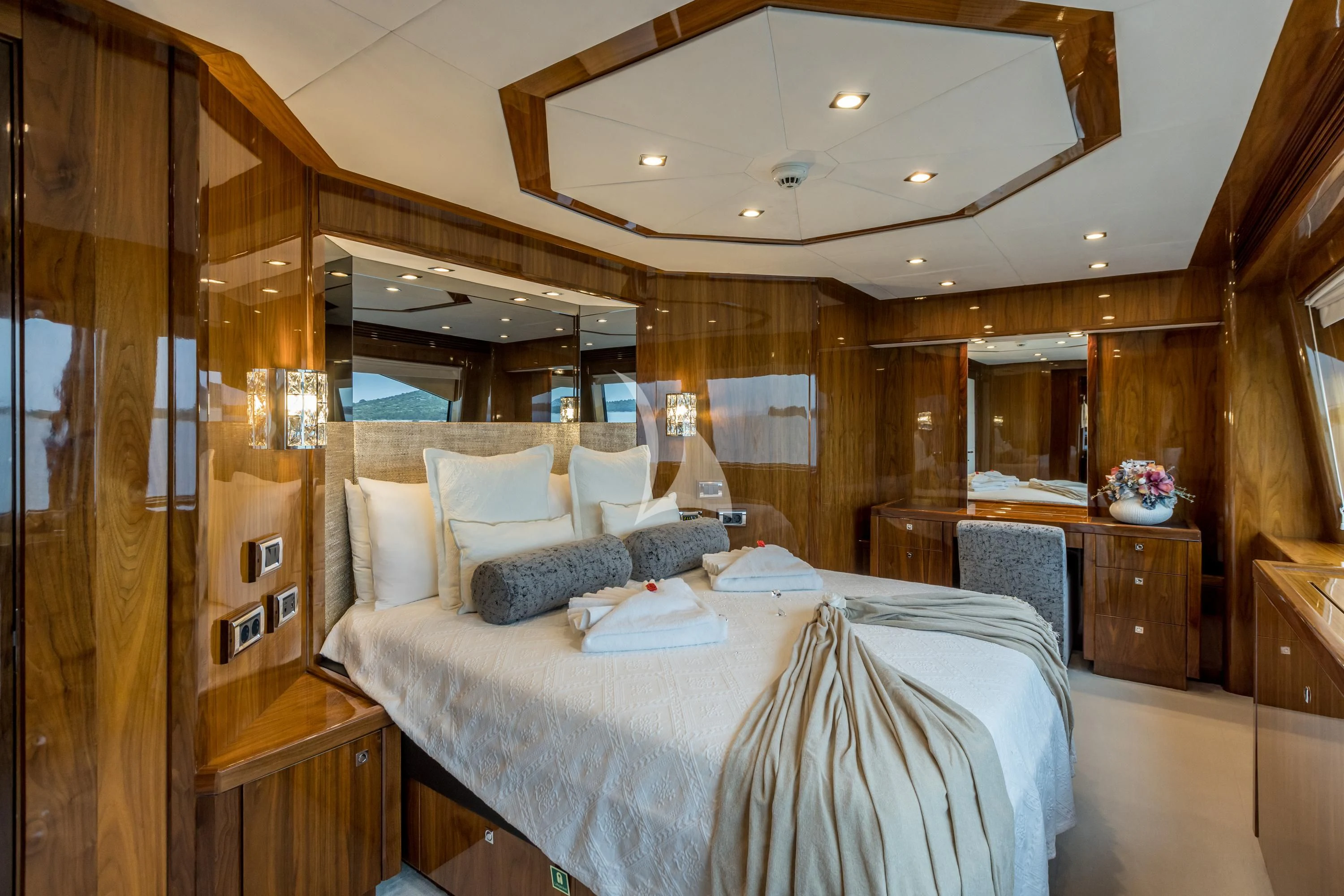 a bedroom with a bed and a mirror aboard KATARIINA I Yacht for Sale