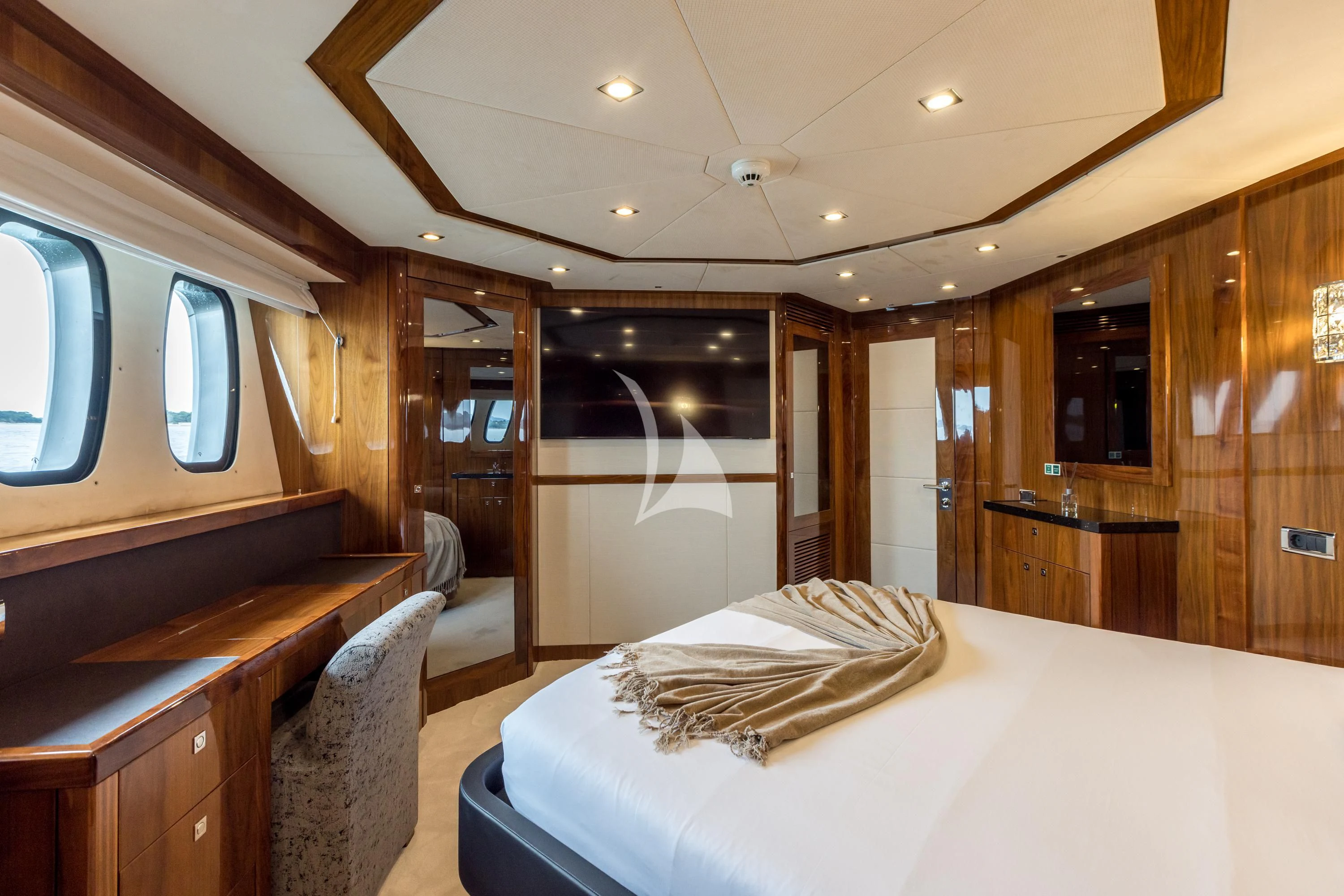 a room with a bed and a desk aboard KATARIINA I Yacht for Sale