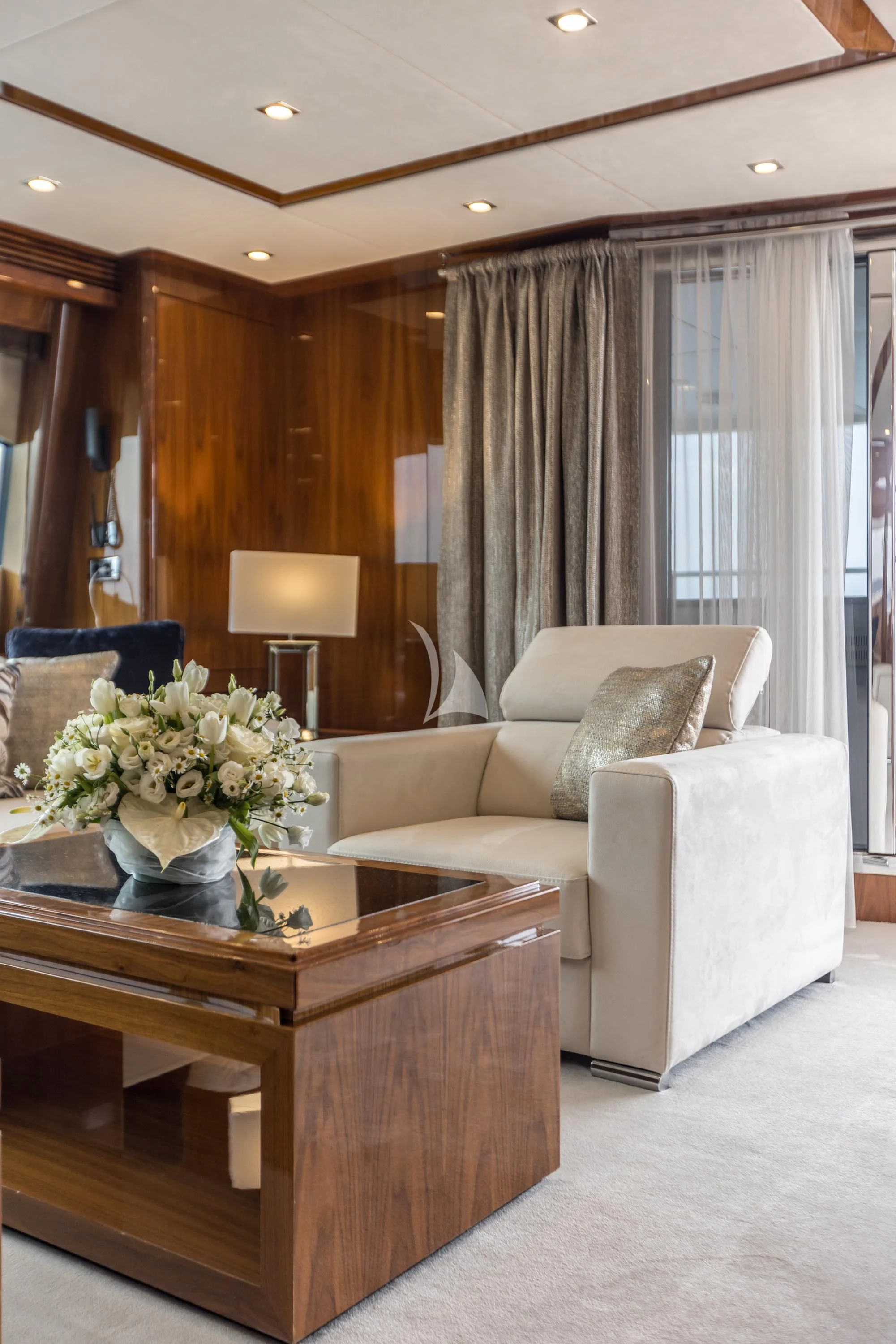 a living room with a table and couches aboard KATARIINA I Yacht for Sale