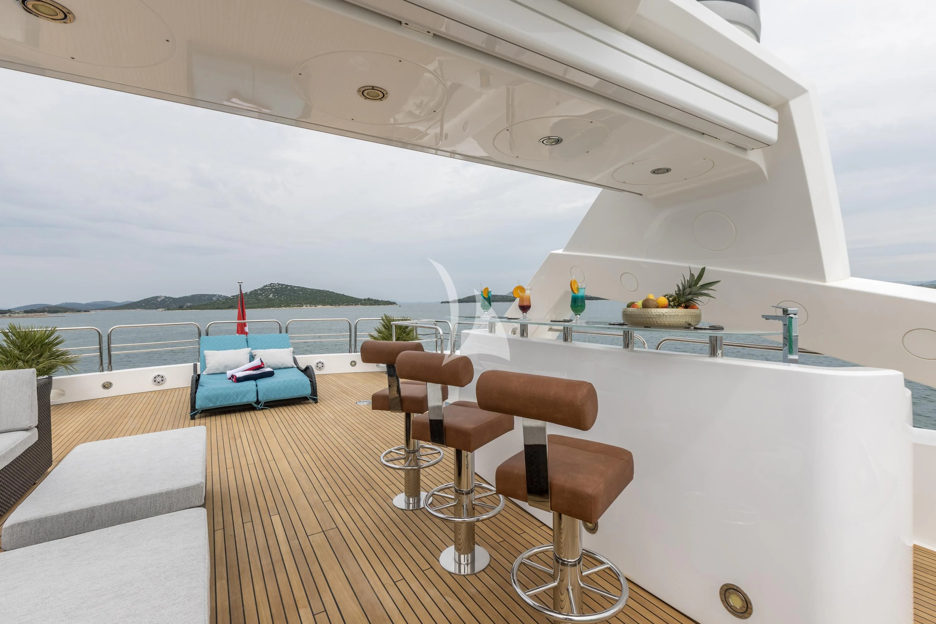 a room with a table chairs and a pool aboard KATARIINA I Yacht for Sale