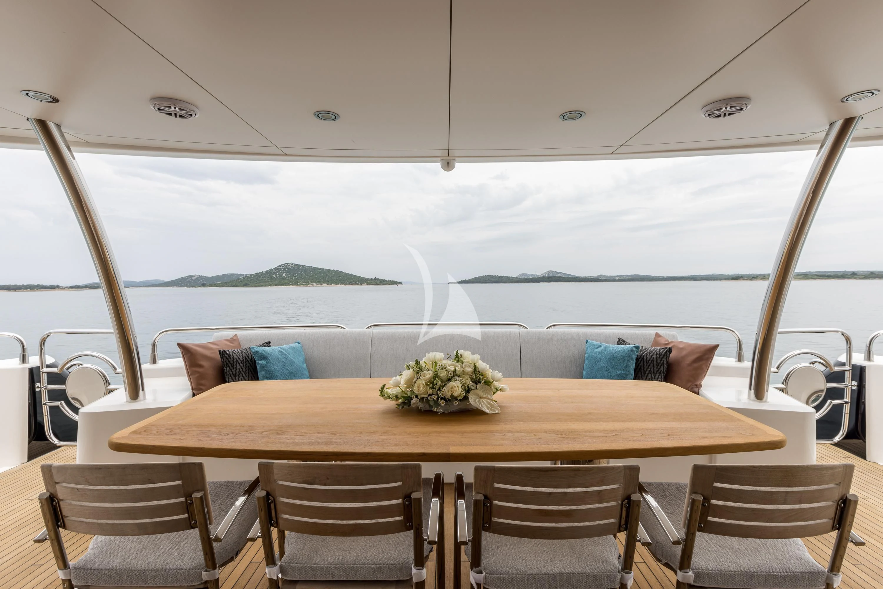 a table with chairs and a couch aboard KATARIINA I Yacht for Sale