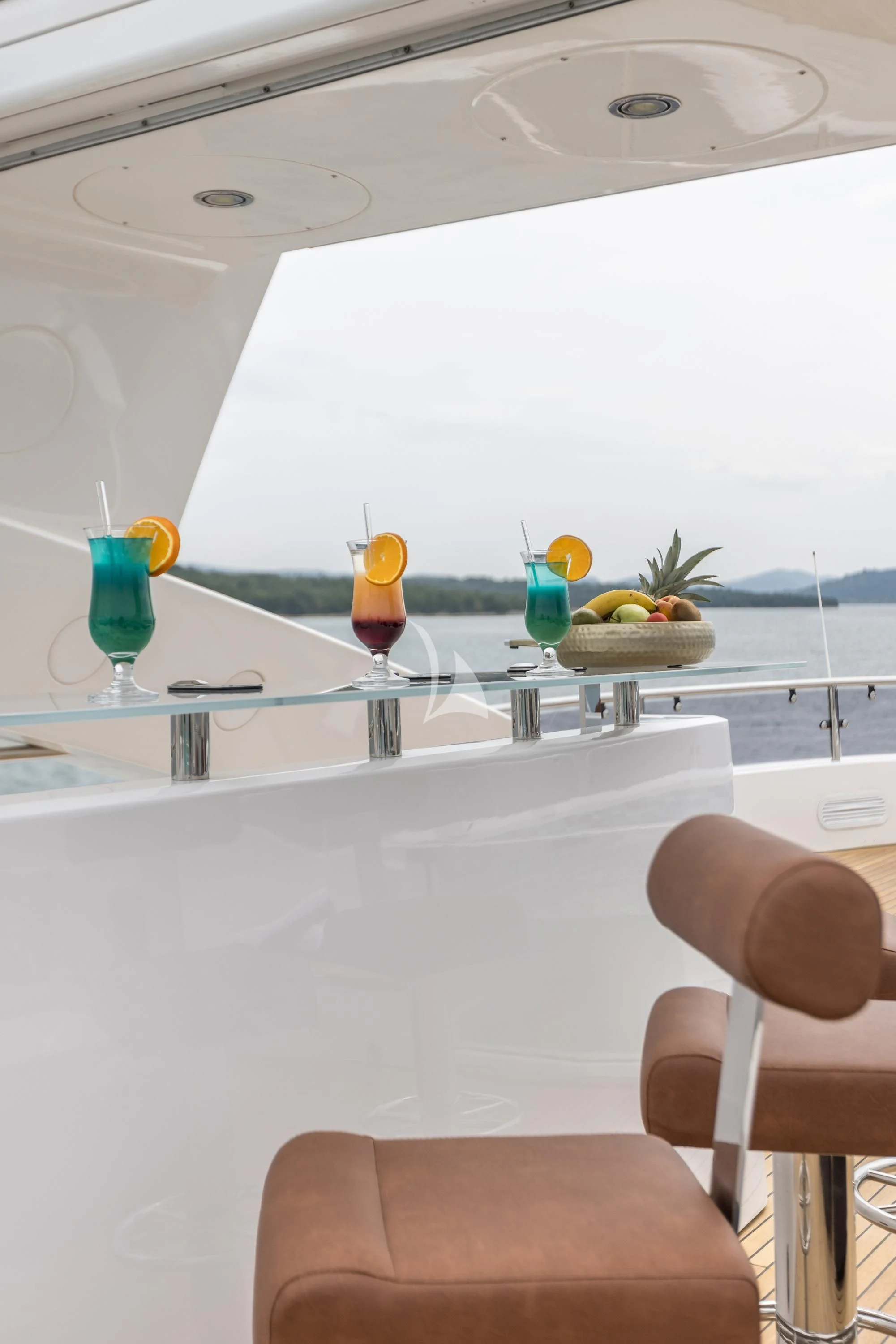 a table with glasses and fruit on it aboard KATARIINA I Yacht for Sale