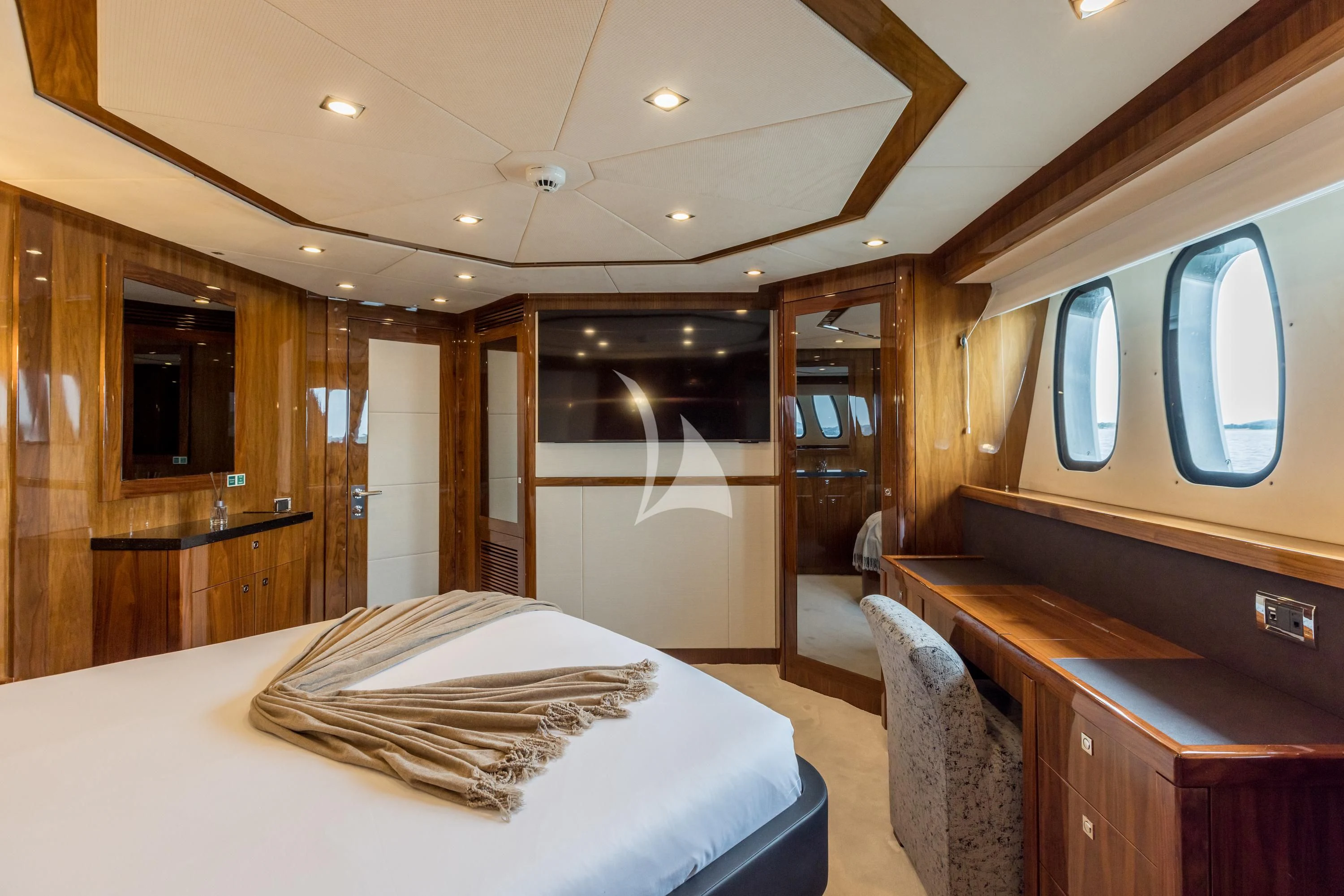 a hotel room with a bed and desk aboard KATARIINA I Yacht for Sale