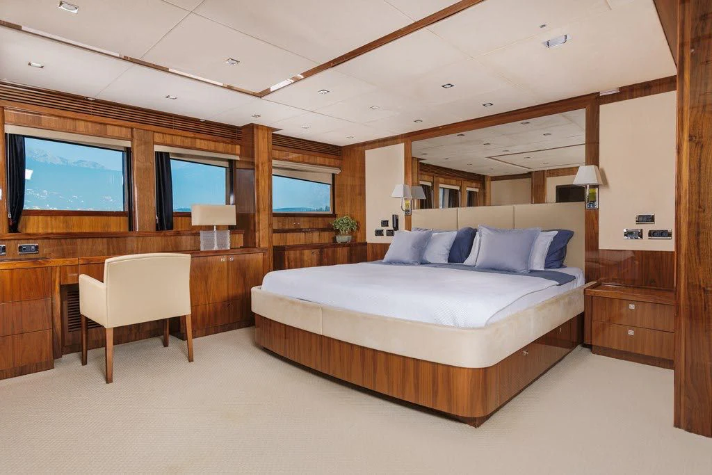 a large bedroom with a large bed aboard KATARIINA I Yacht for Sale