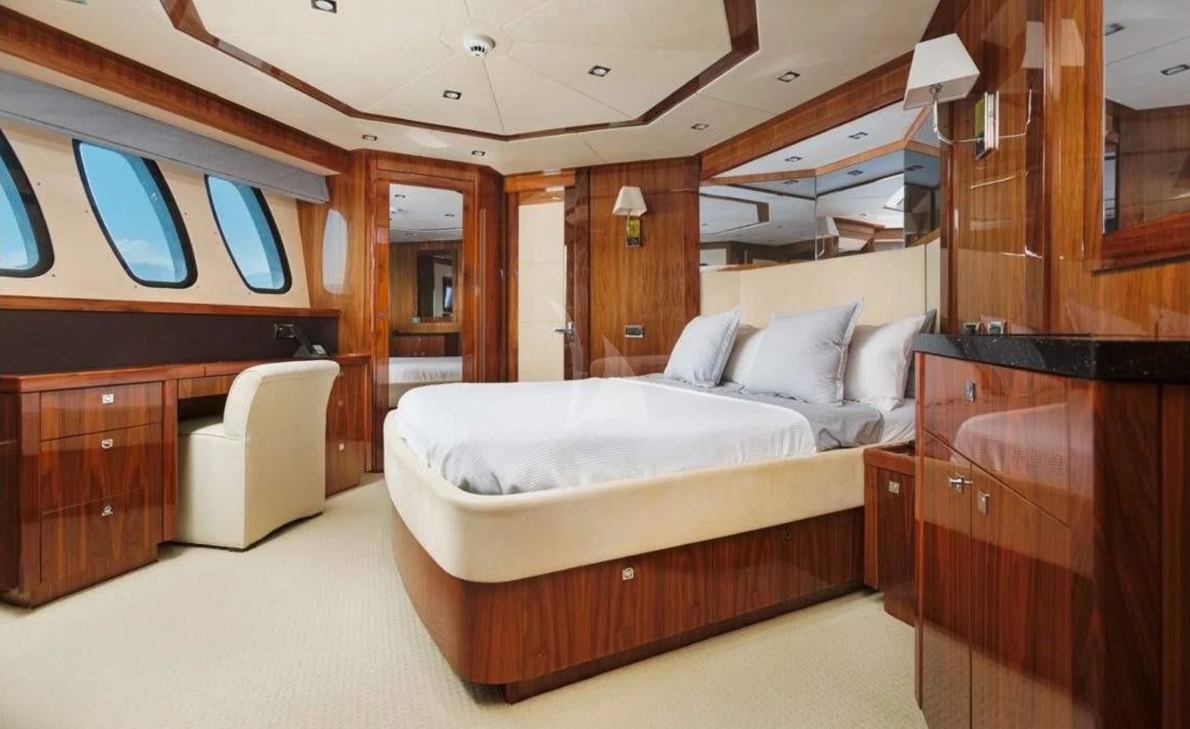 a room with a bed and a chair aboard KATARIINA I Yacht for Sale