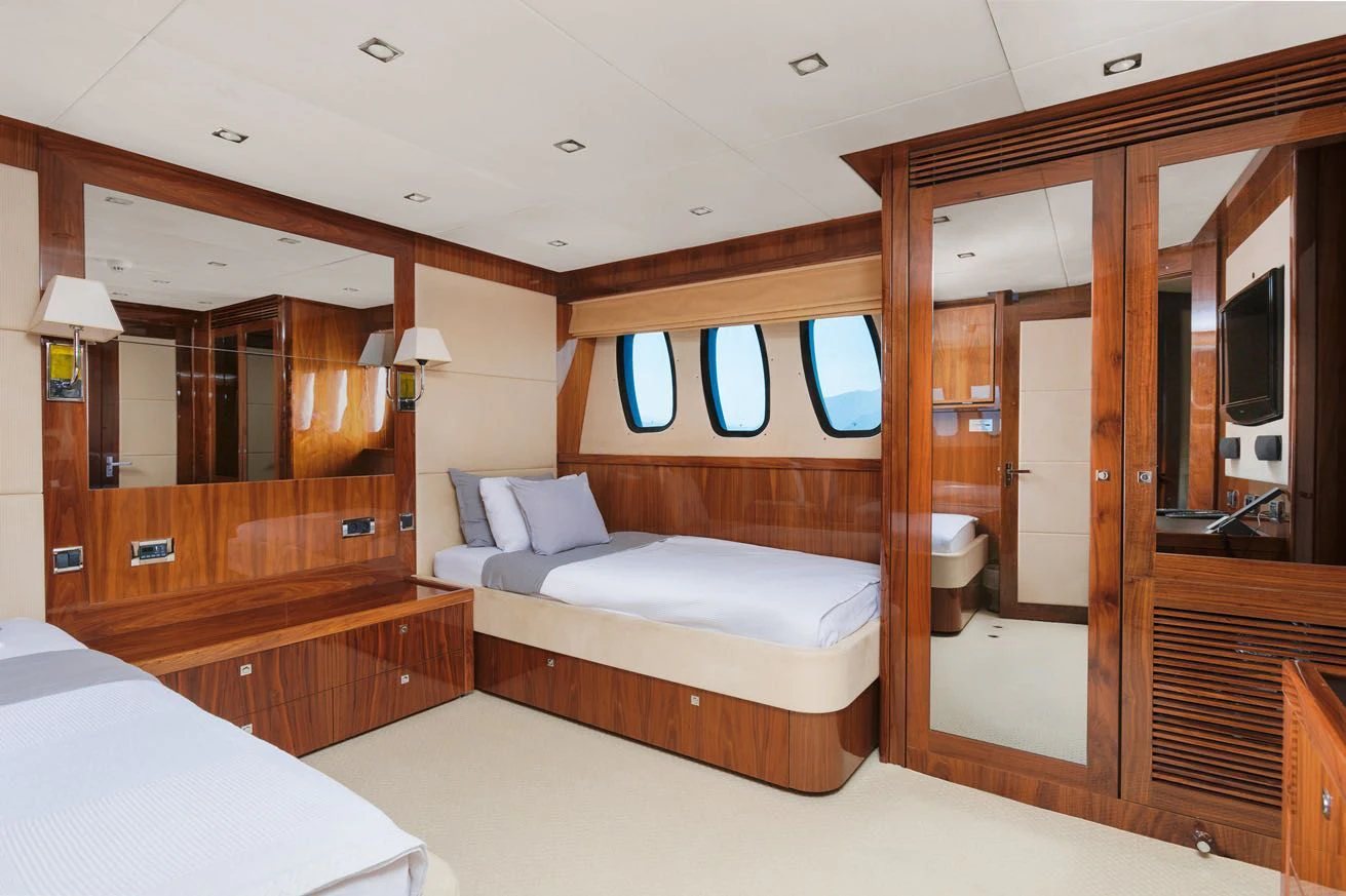 a hotel room with a bed and a mirror aboard KATARIINA I Yacht for Sale