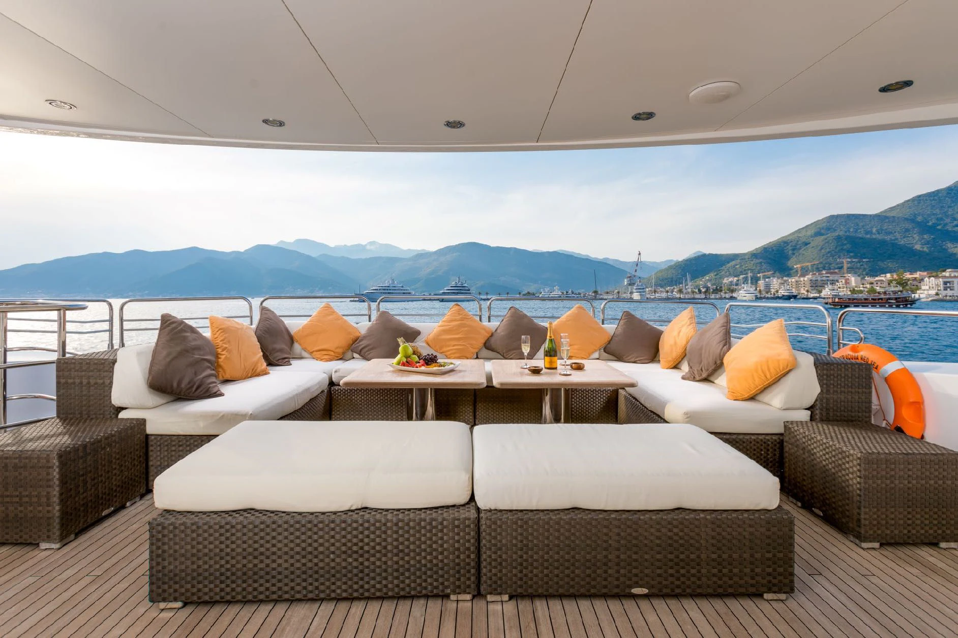a room with couches and a table and a large body of water aboard KATARIINA I Yacht for Sale