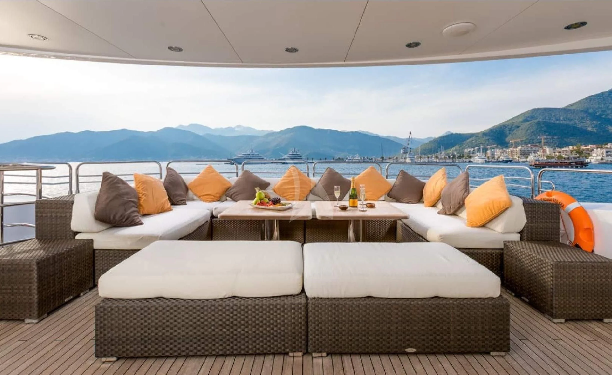 a room with couches and a table and a view of the water aboard KATARIINA I Yacht for Sale