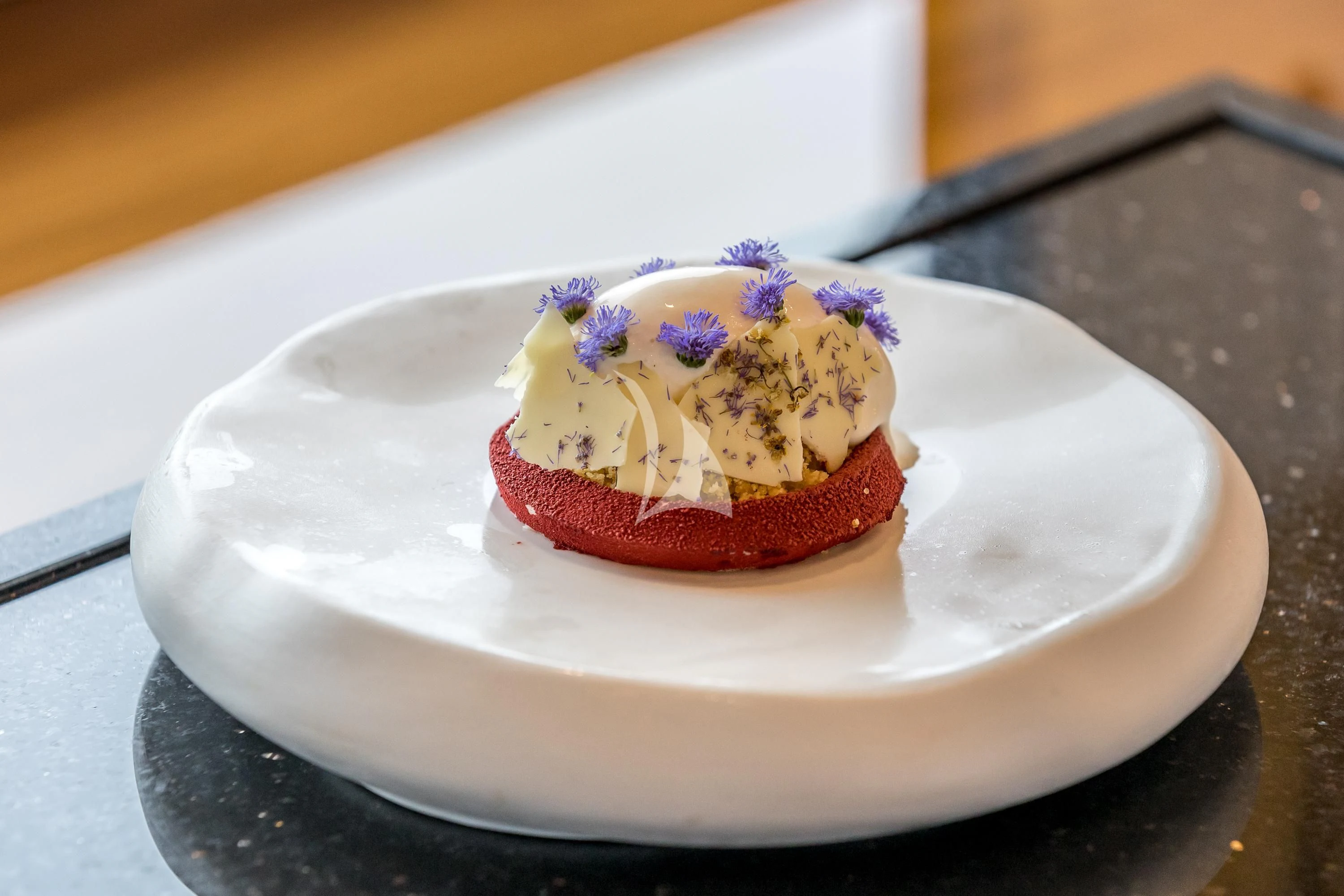 a cake on a plate aboard KATARIINA I Yacht for Sale