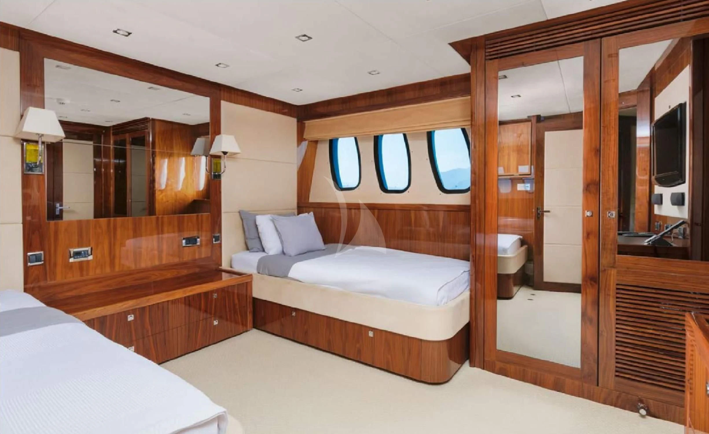 a room with a bed and a mirror aboard KATARIINA I Yacht for Sale