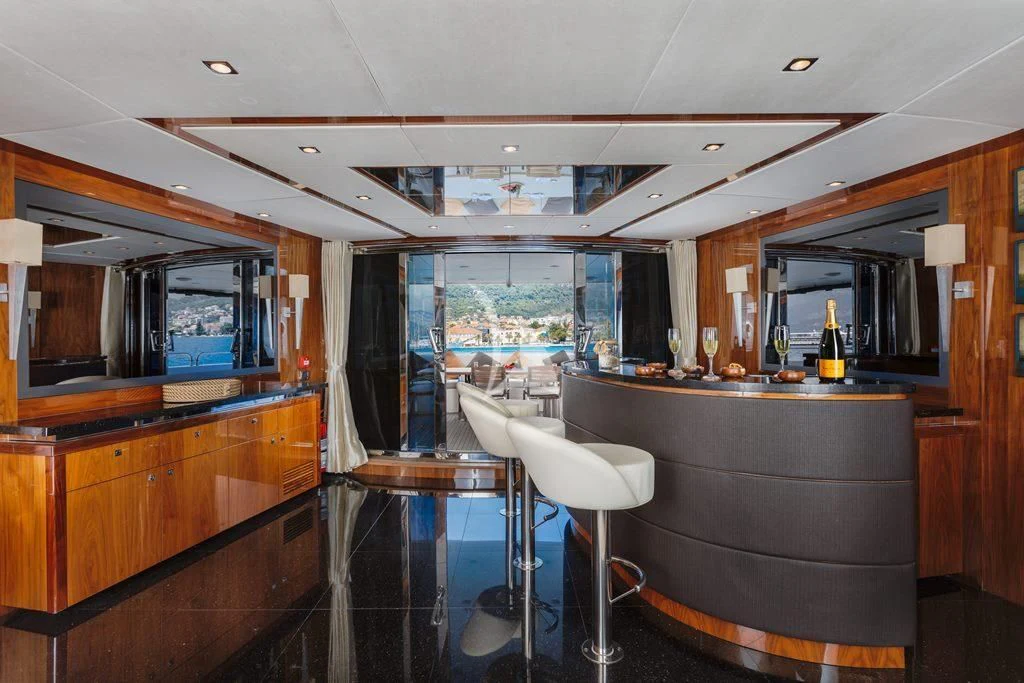 a kitchen with a bar and a bar aboard KATARIINA I Yacht for Sale