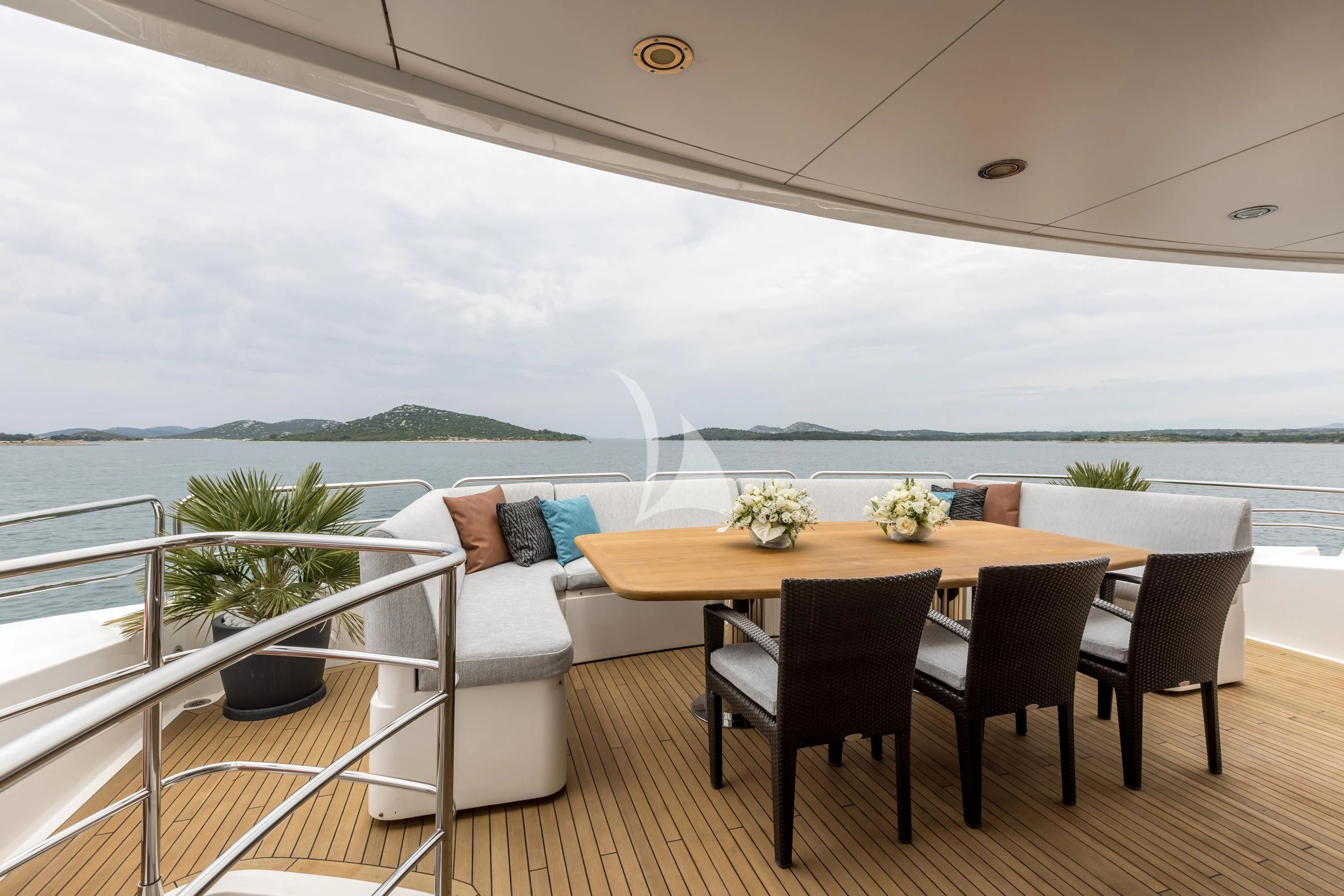 a table and chairs on a balcony aboard KATARIINA I Yacht for Sale
