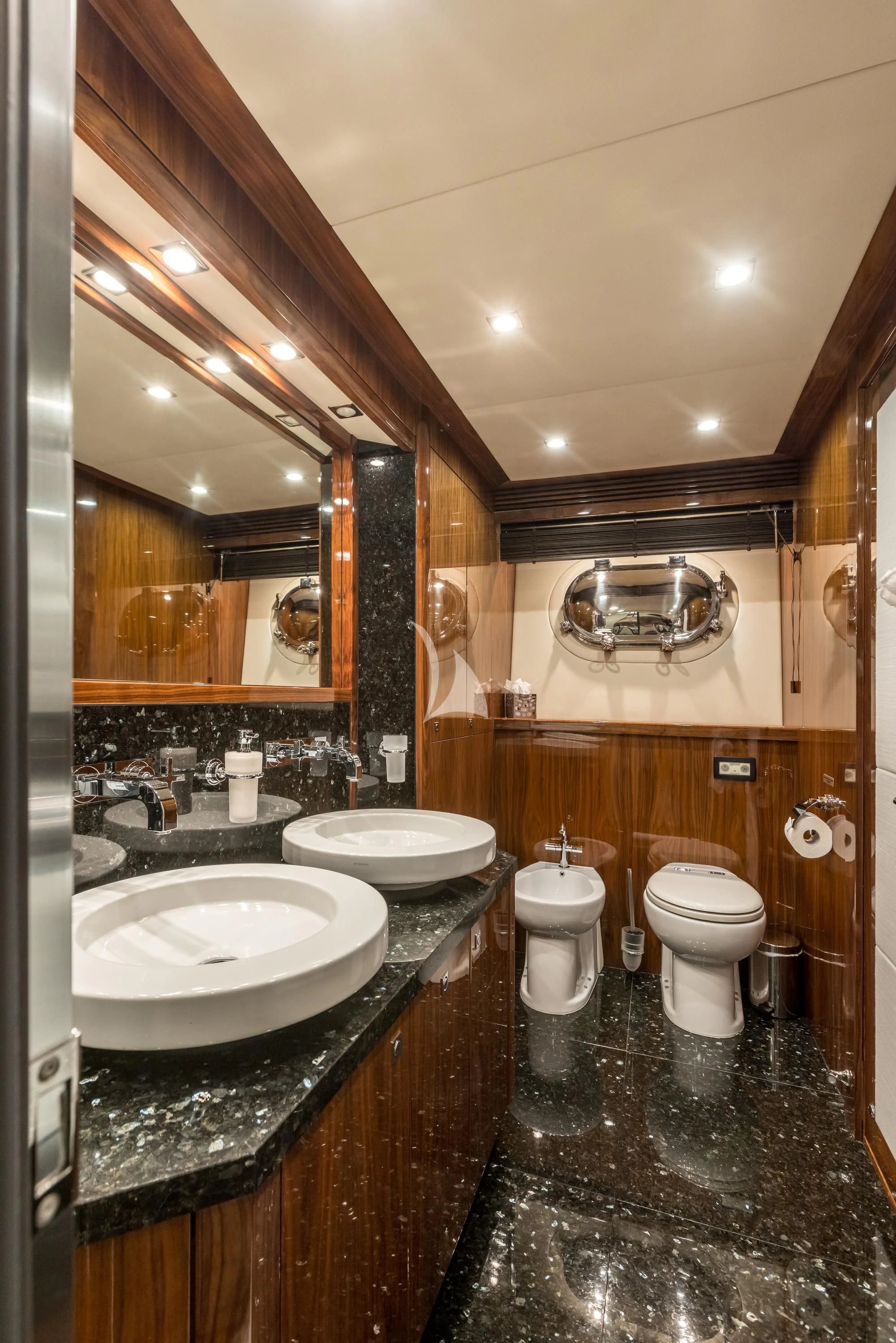 a bathroom with a large mirror aboard KATARIINA I Yacht for Sale