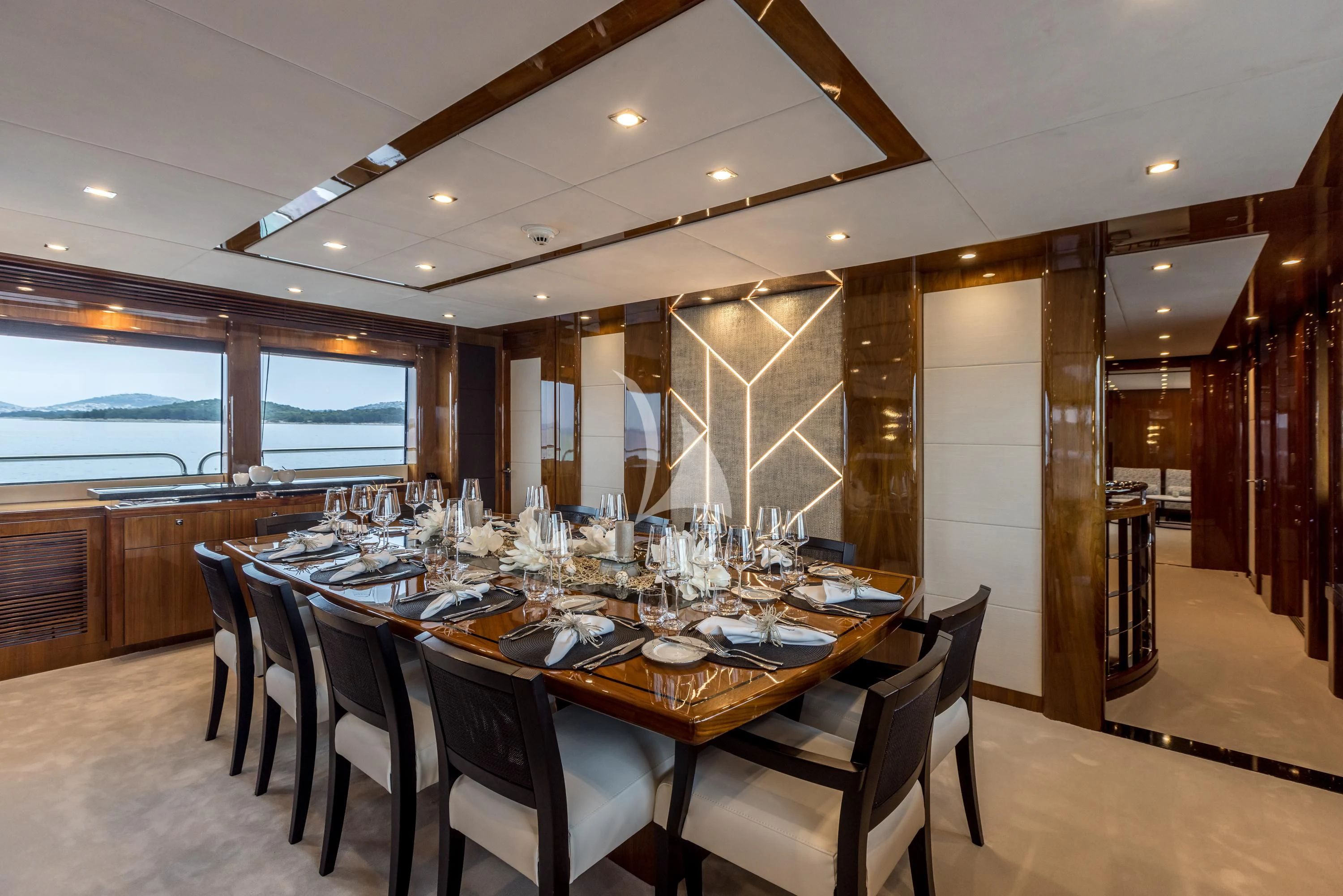 a dining room with a table set for dinner aboard KATARIINA I Yacht for Sale