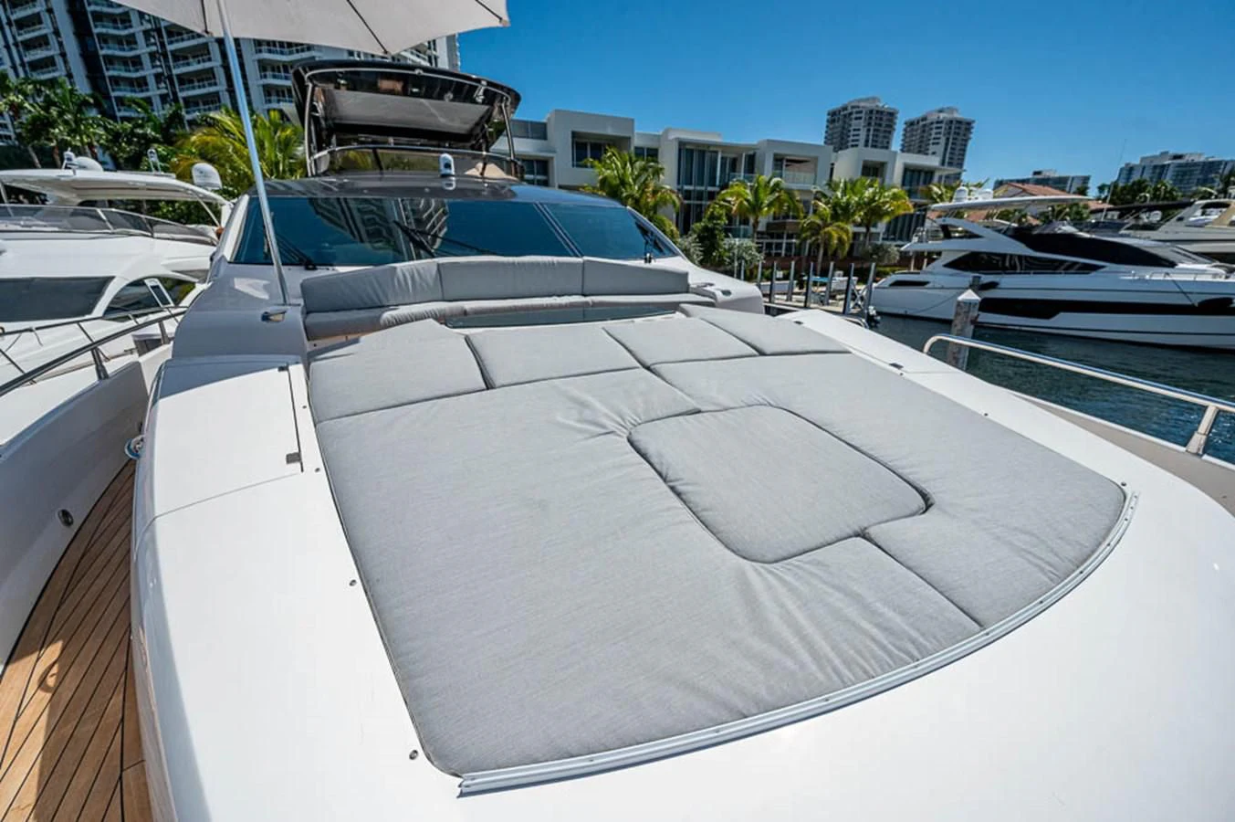 a white boat in a harbor aboard MOZZ II Yacht for Sale