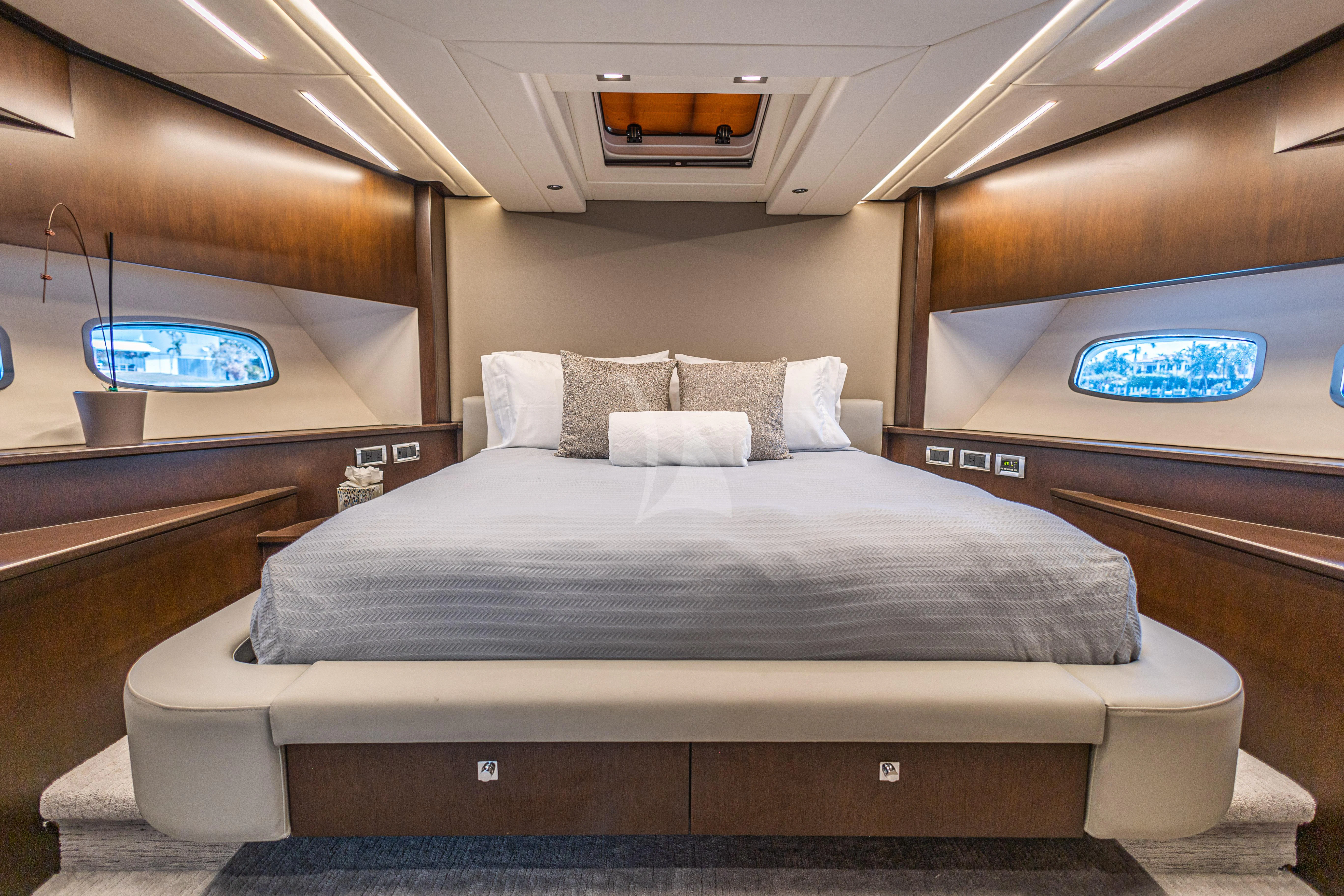 a bed in a room aboard MOZZ II Yacht for Sale
