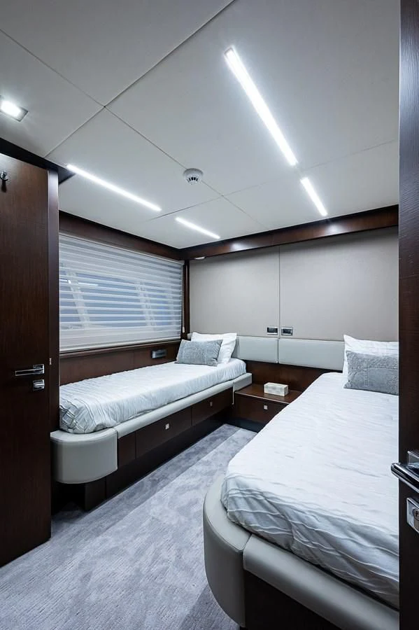 a room with two beds aboard MOZZ II Yacht for Sale