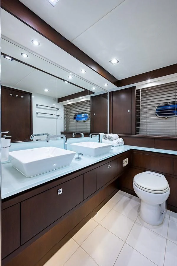 a bathroom with a large mirror aboard MOZZ II Yacht for Sale