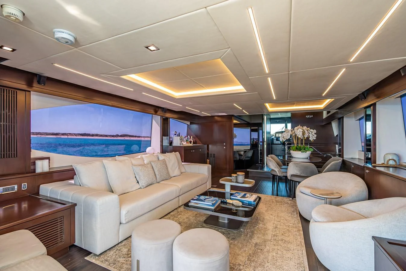 a living room with a large blue screen aboard MOZZ II Yacht for Sale