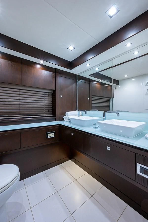 a bathroom with a large mirror aboard MOZZ II Yacht for Sale