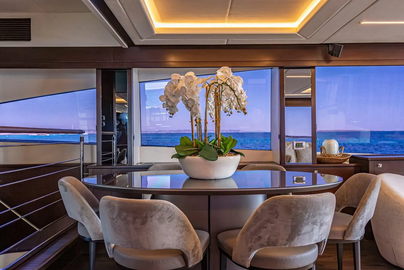 a large room with a table and chairs and a large window aboard MOZZ II Yacht for Sale