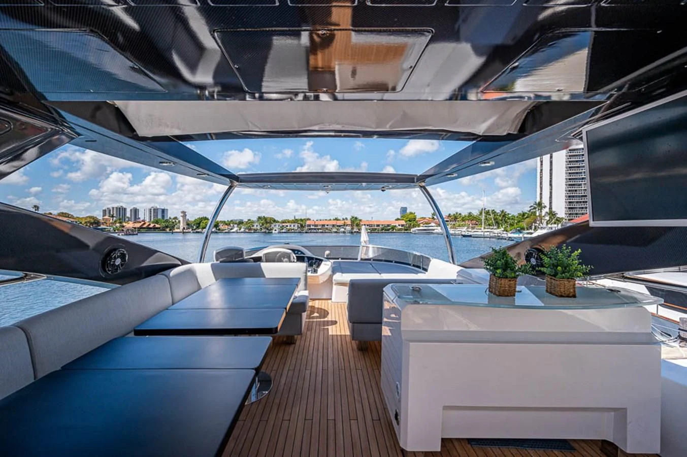 a room with a view of a city and a large pool aboard MOZZ II Yacht for Sale