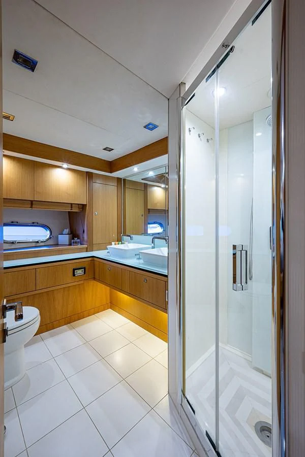 a bathroom with a glass shower aboard MOZZ II Yacht for Sale