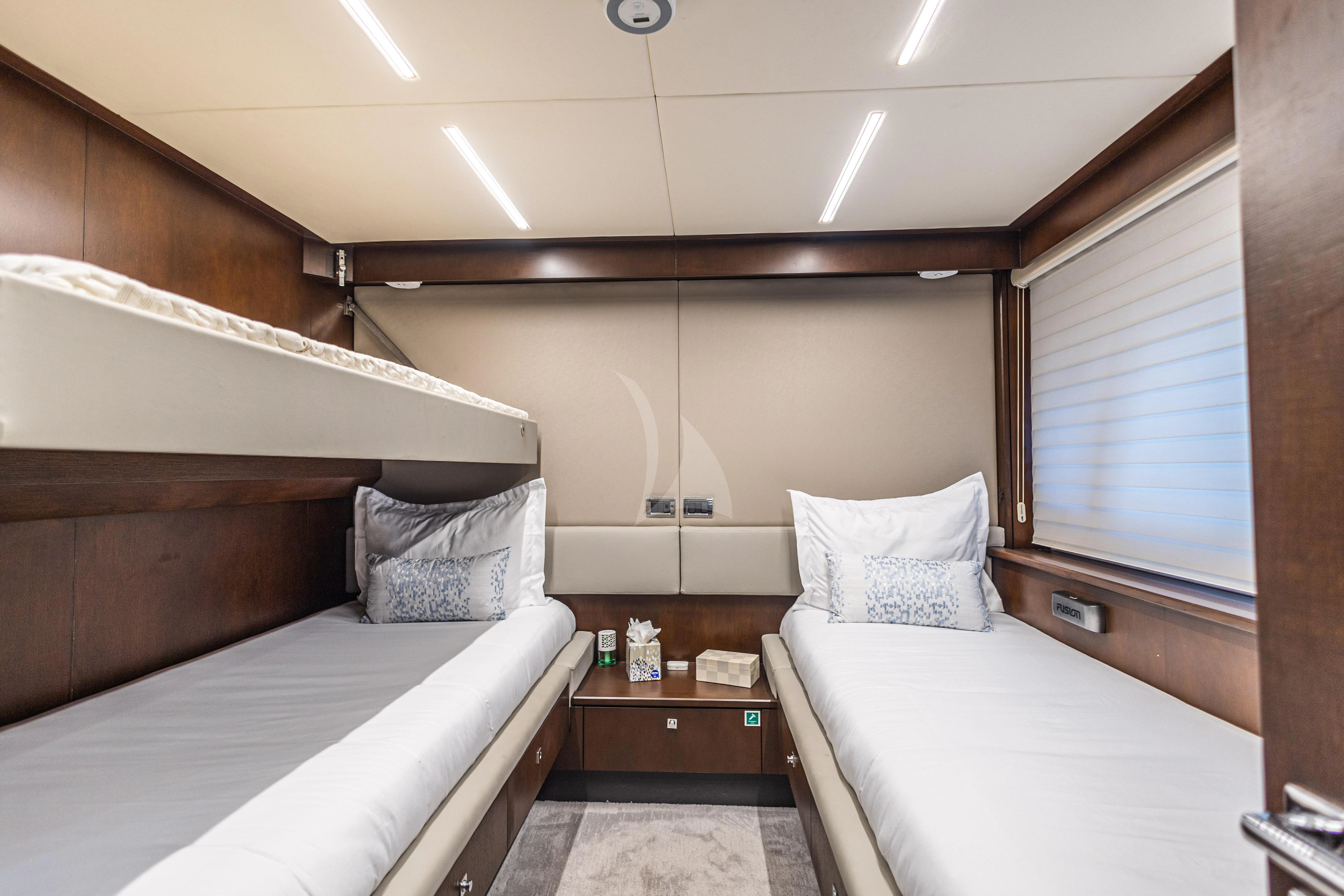 a room with two beds aboard MOZZ II Yacht for Sale