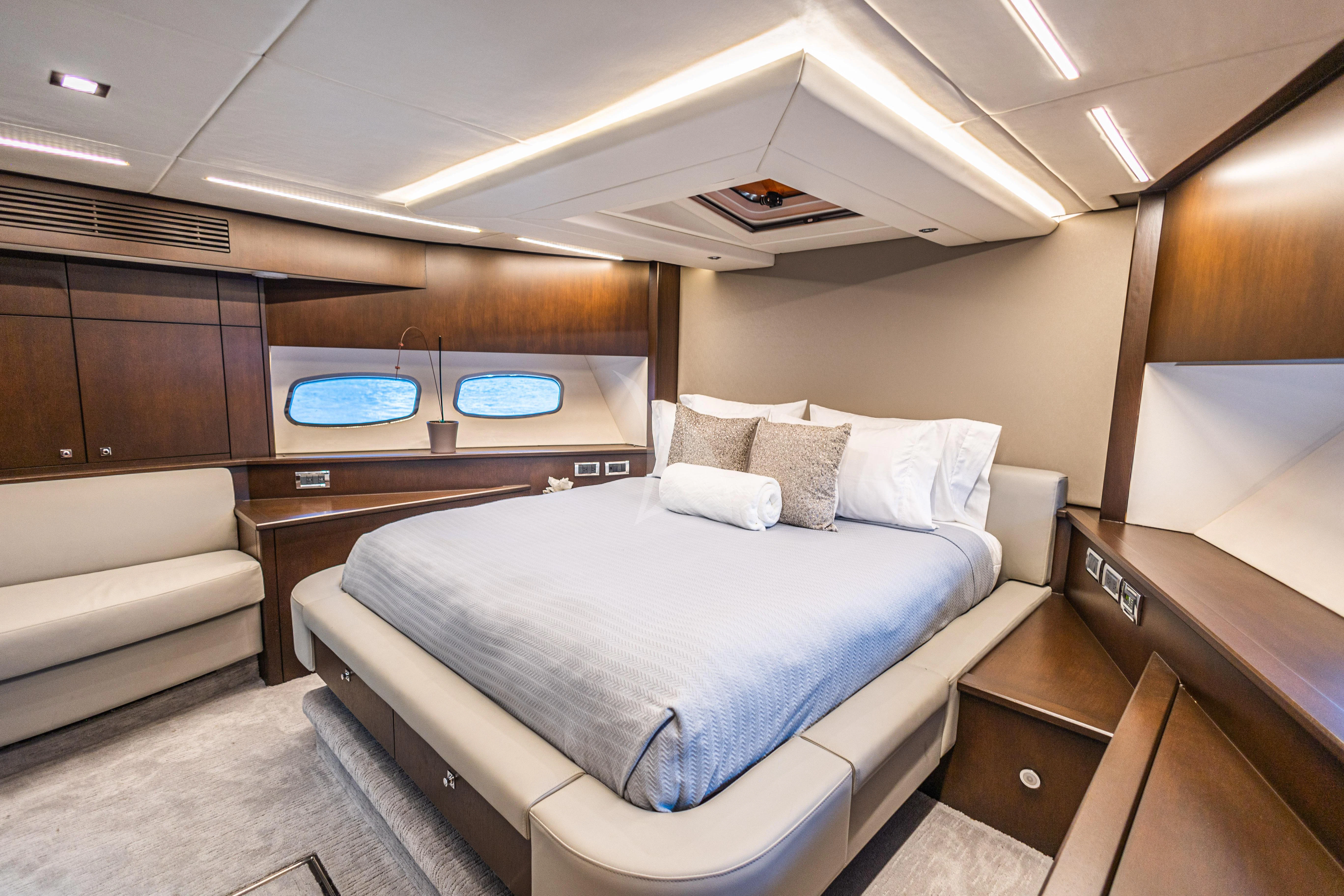 a room with a bed and a desk aboard MOZZ II Yacht for Sale