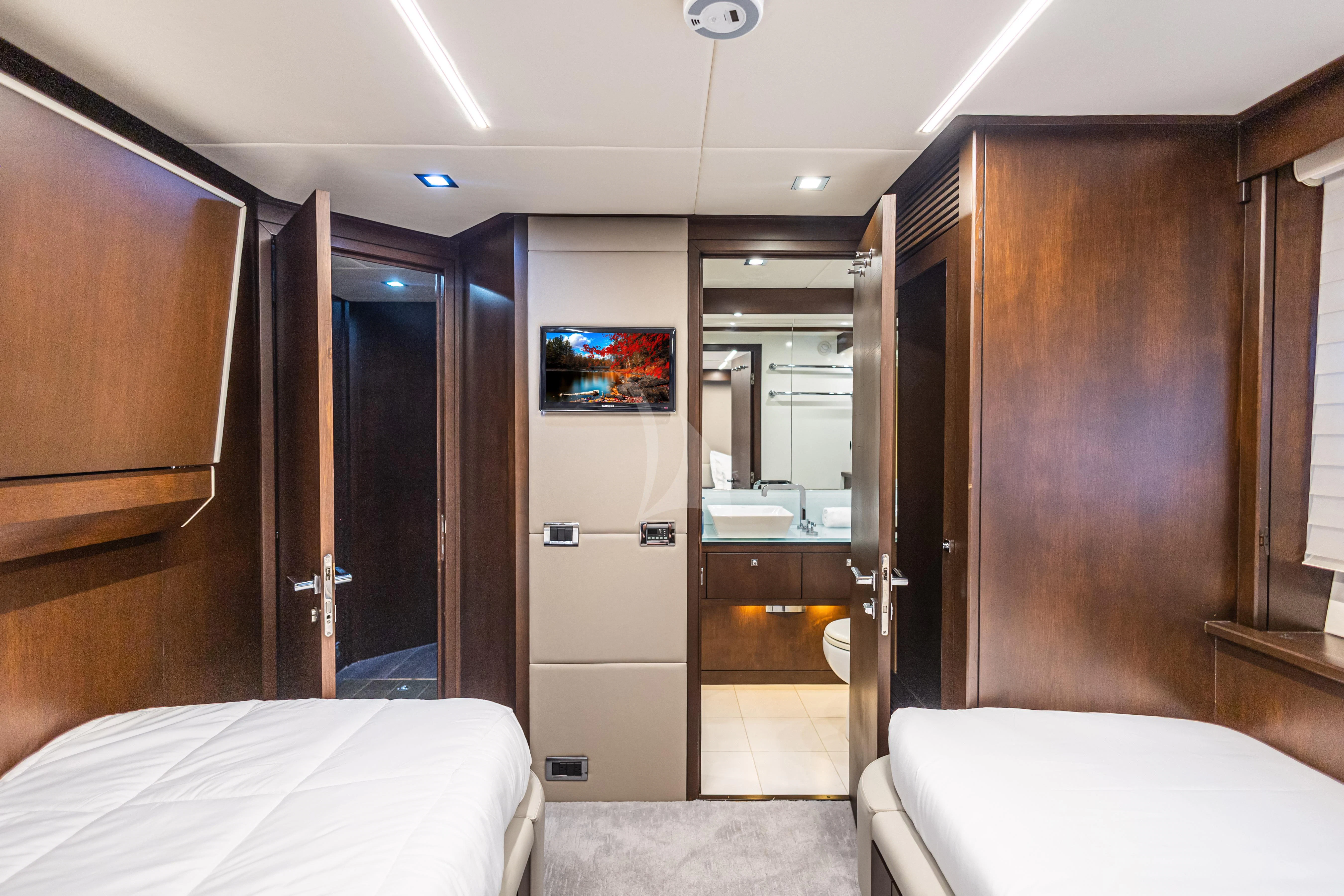 a hotel room with a bed and a mirror aboard MOZZ II Yacht for Sale