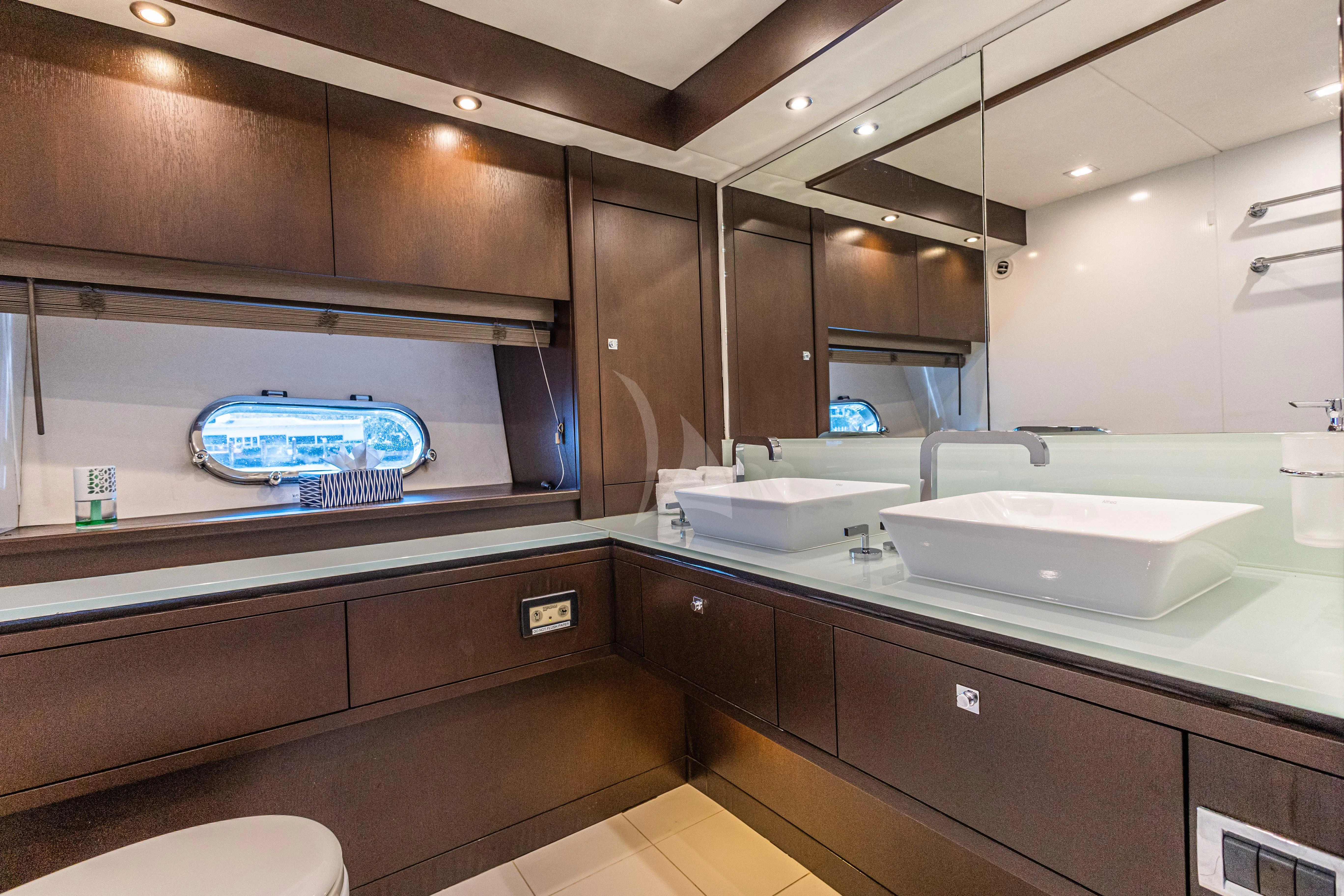a modern bathroom with a large screen aboard MOZZ II Yacht for Sale