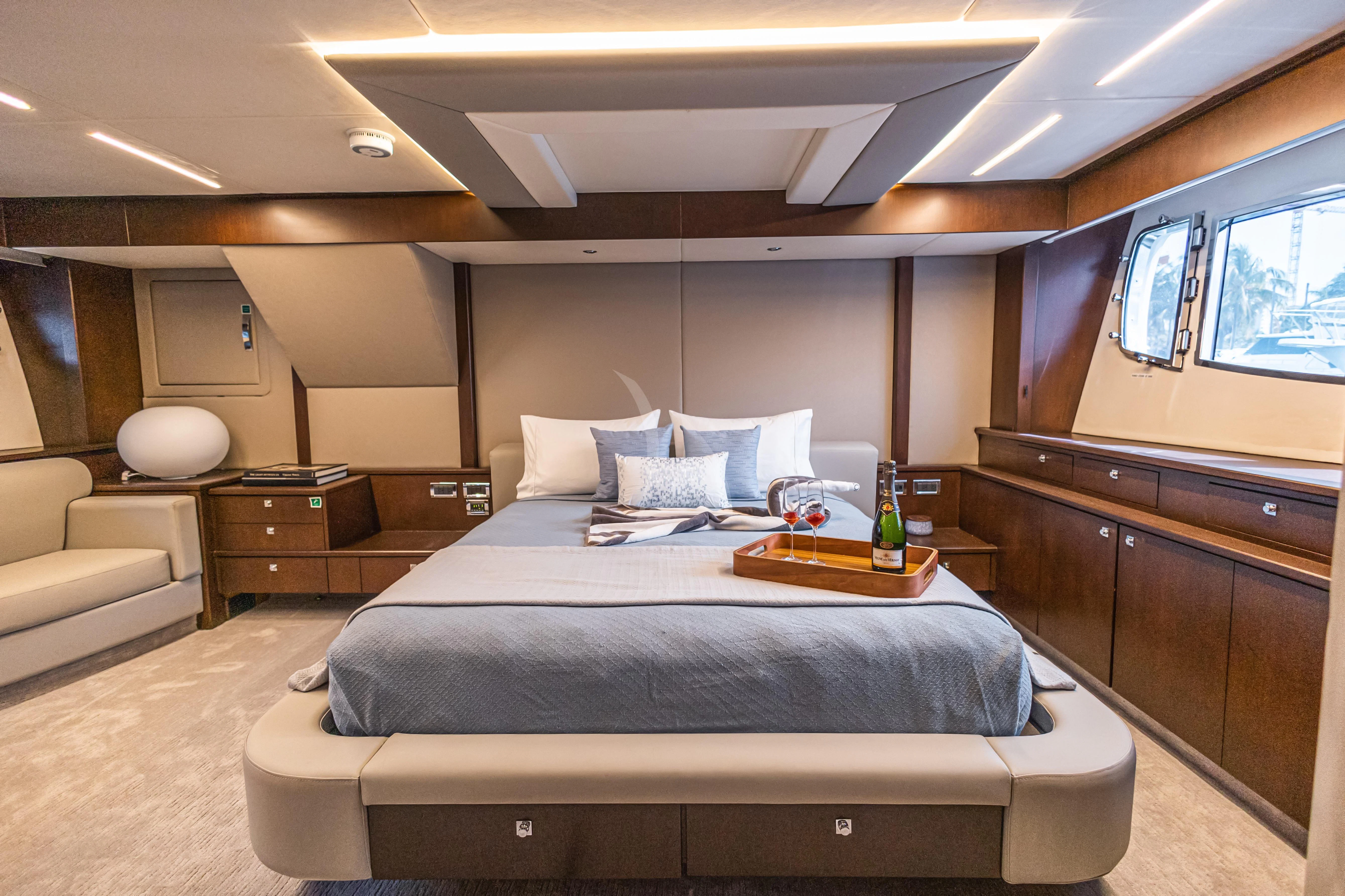 a room with a bed and a table aboard MOZZ II Yacht for Sale
