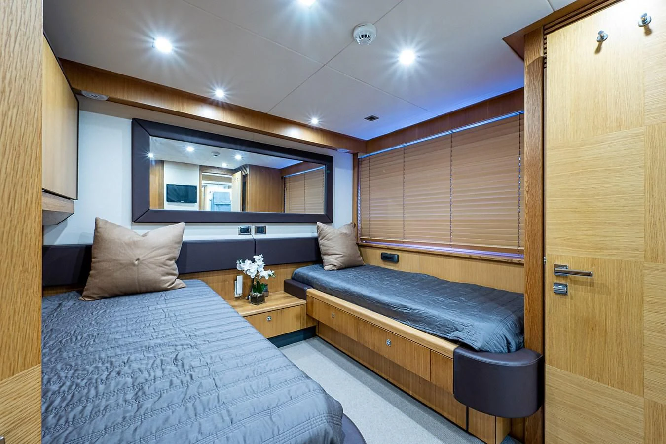 a room with a bed and a door aboard MOZZ II Yacht for Sale