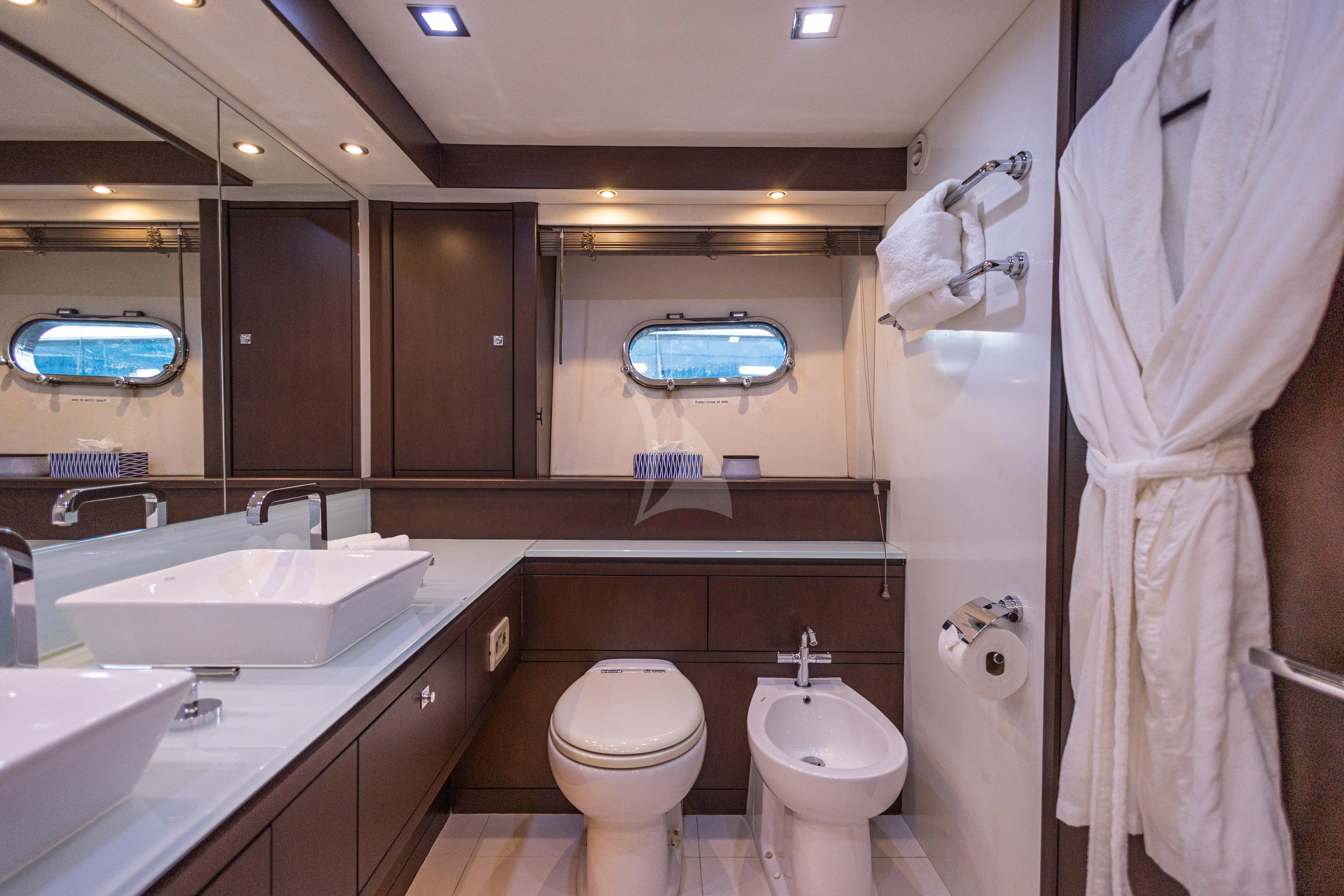 a bathroom with a sink toilet and a bathtub aboard MOZZ II Yacht for Sale