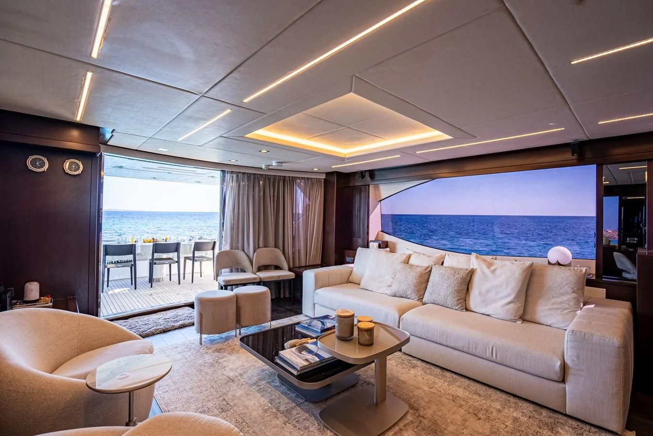 a living room with a large window aboard MOZZ II Yacht for Sale
