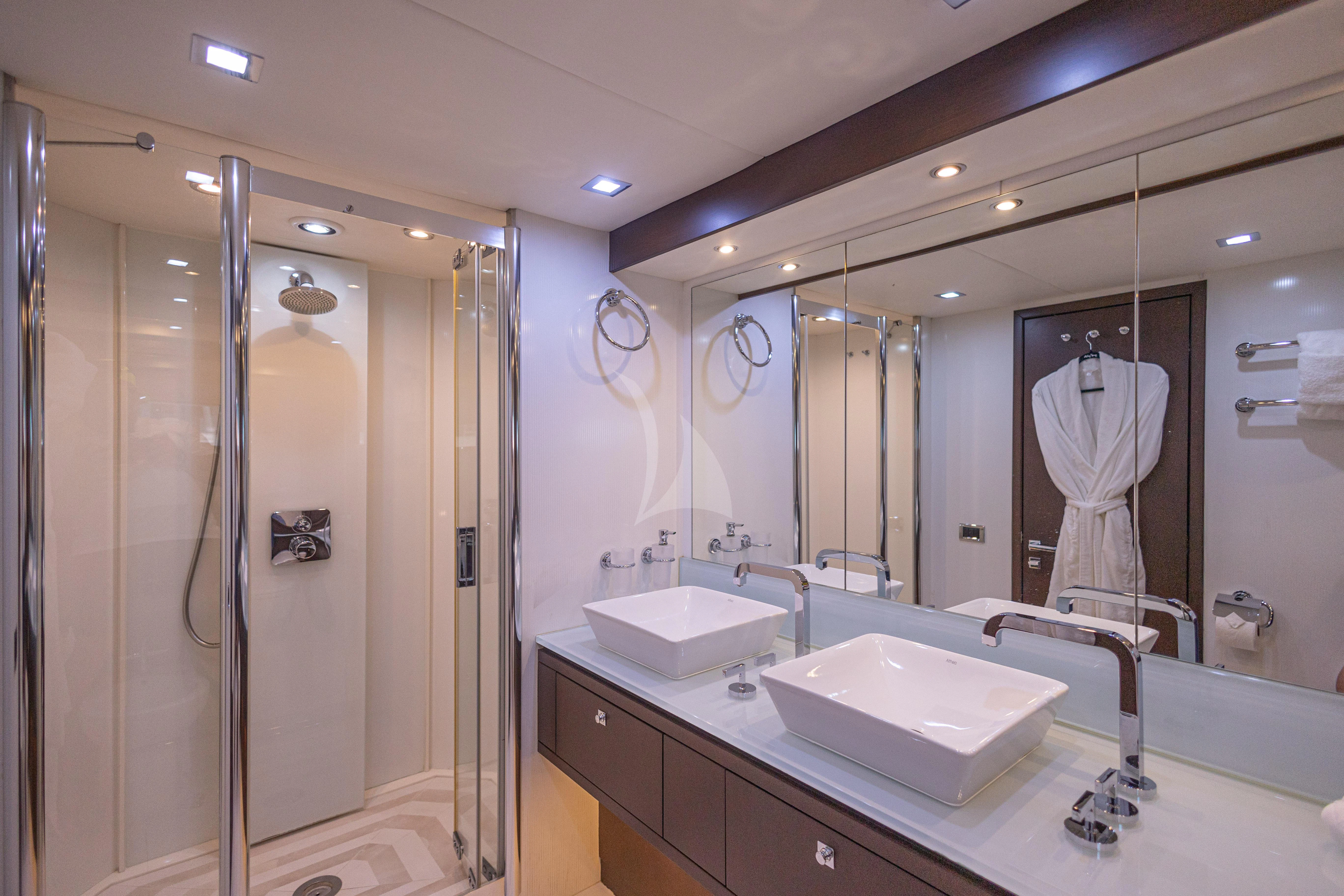 a bathroom with a large mirror aboard MOZZ II Yacht for Sale
