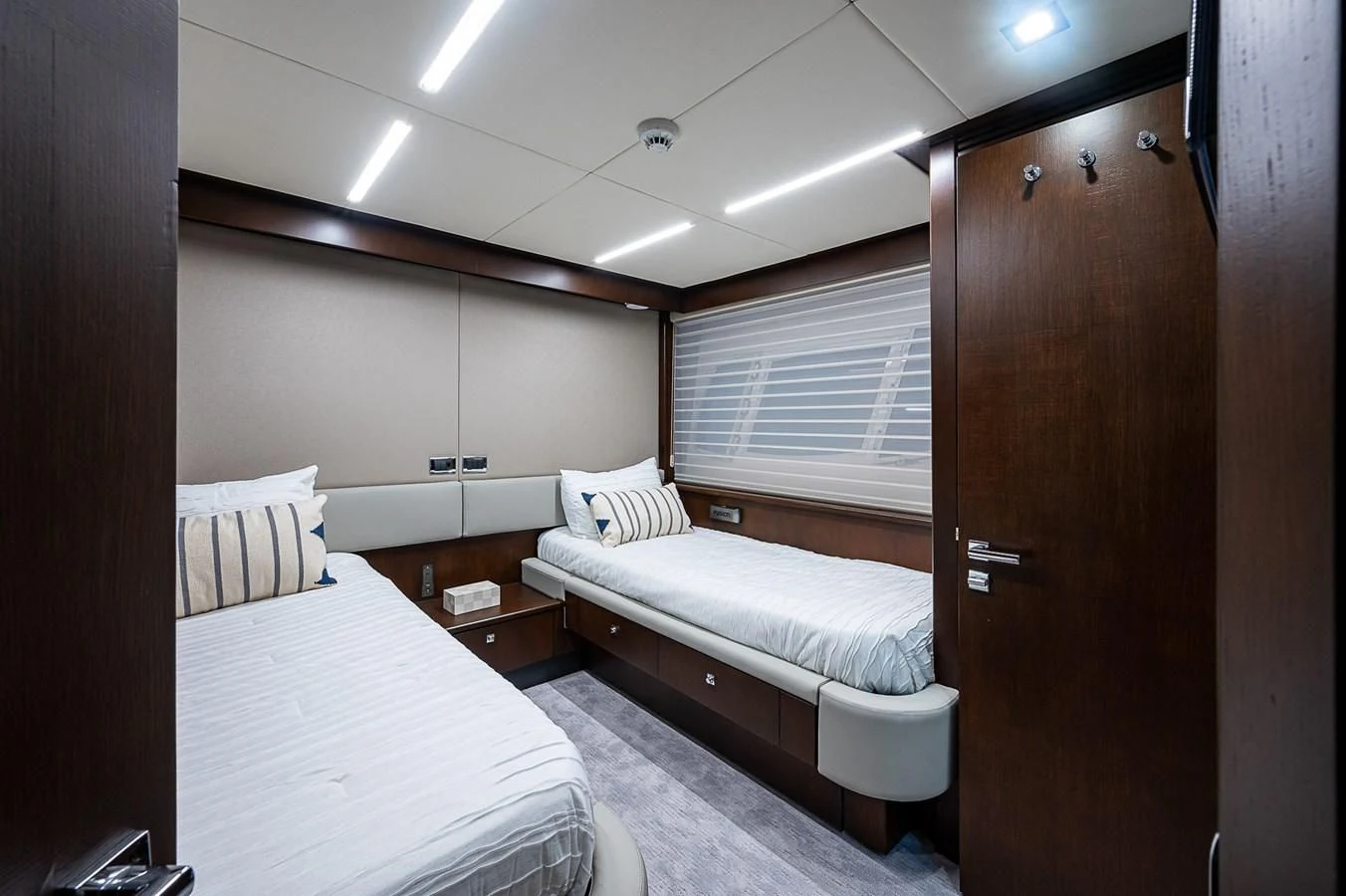 a room with a bed and a closet aboard MOZZ II Yacht for Sale