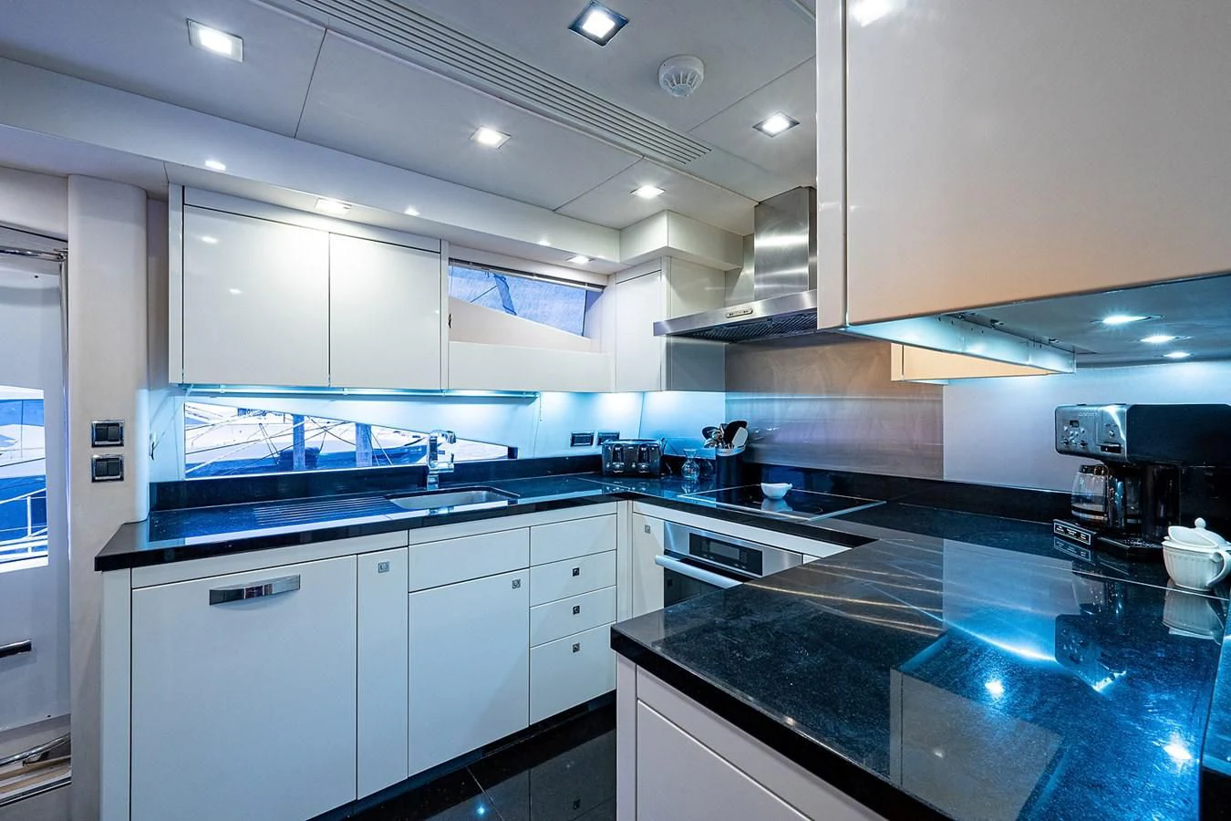 a kitchen with a large island aboard MOZZ II Yacht for Sale