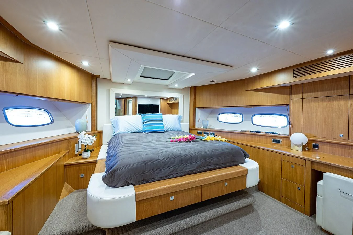a bedroom with a bed and a television aboard MOZZ II Yacht for Sale
