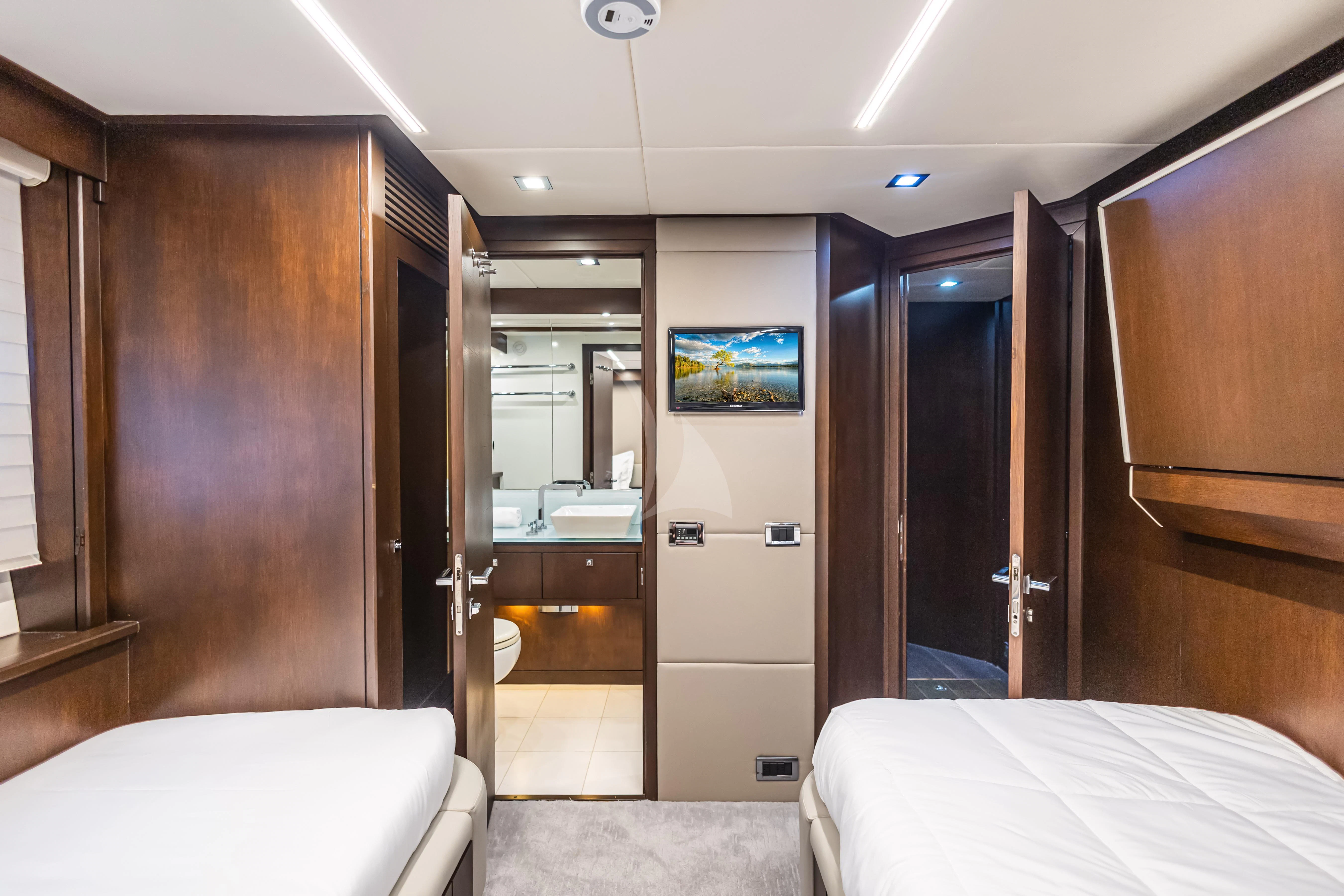 a hotel room with a bed and a large mirror aboard MOZZ II Yacht for Sale