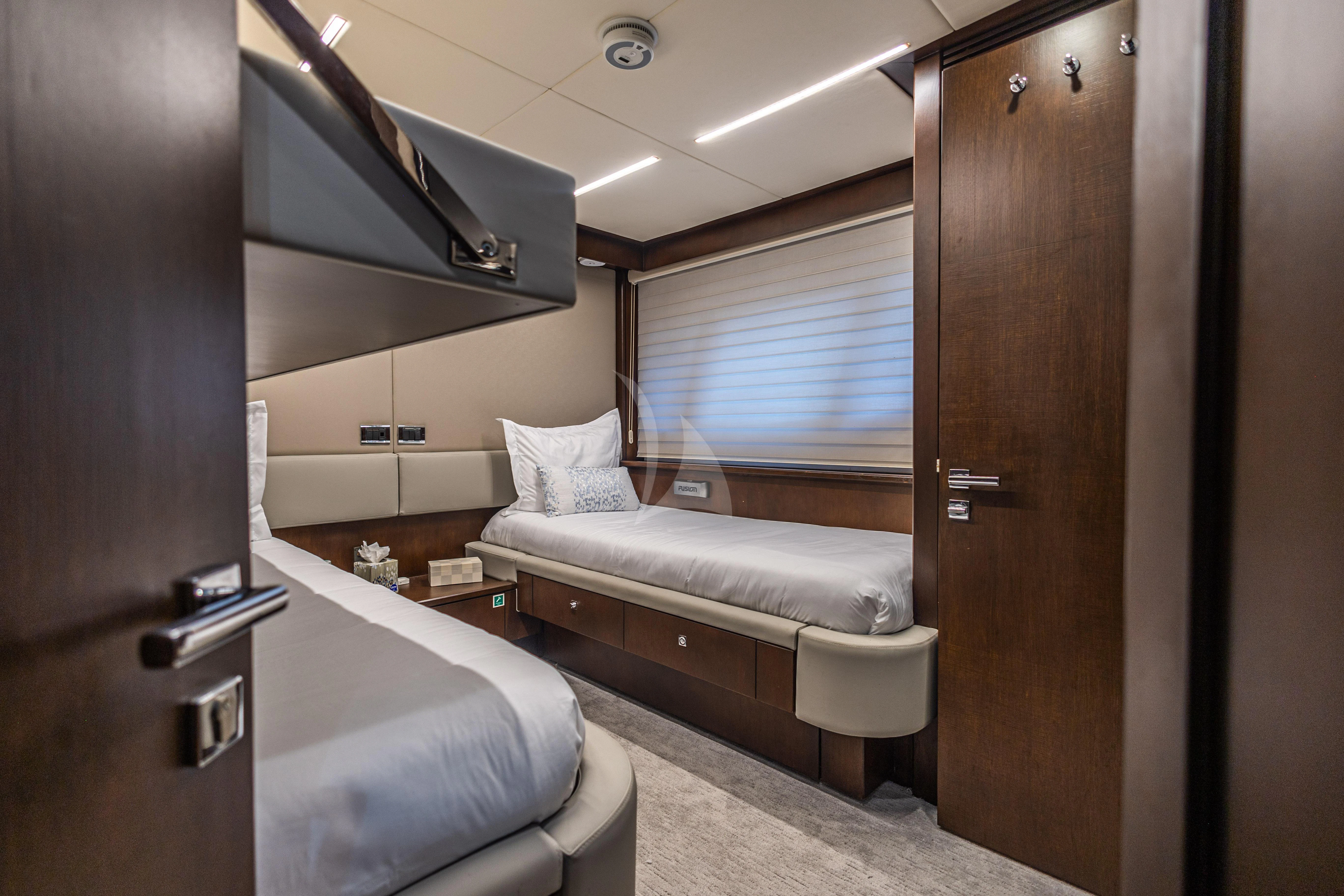 a room with a bed and a desk aboard MOZZ II Yacht for Sale