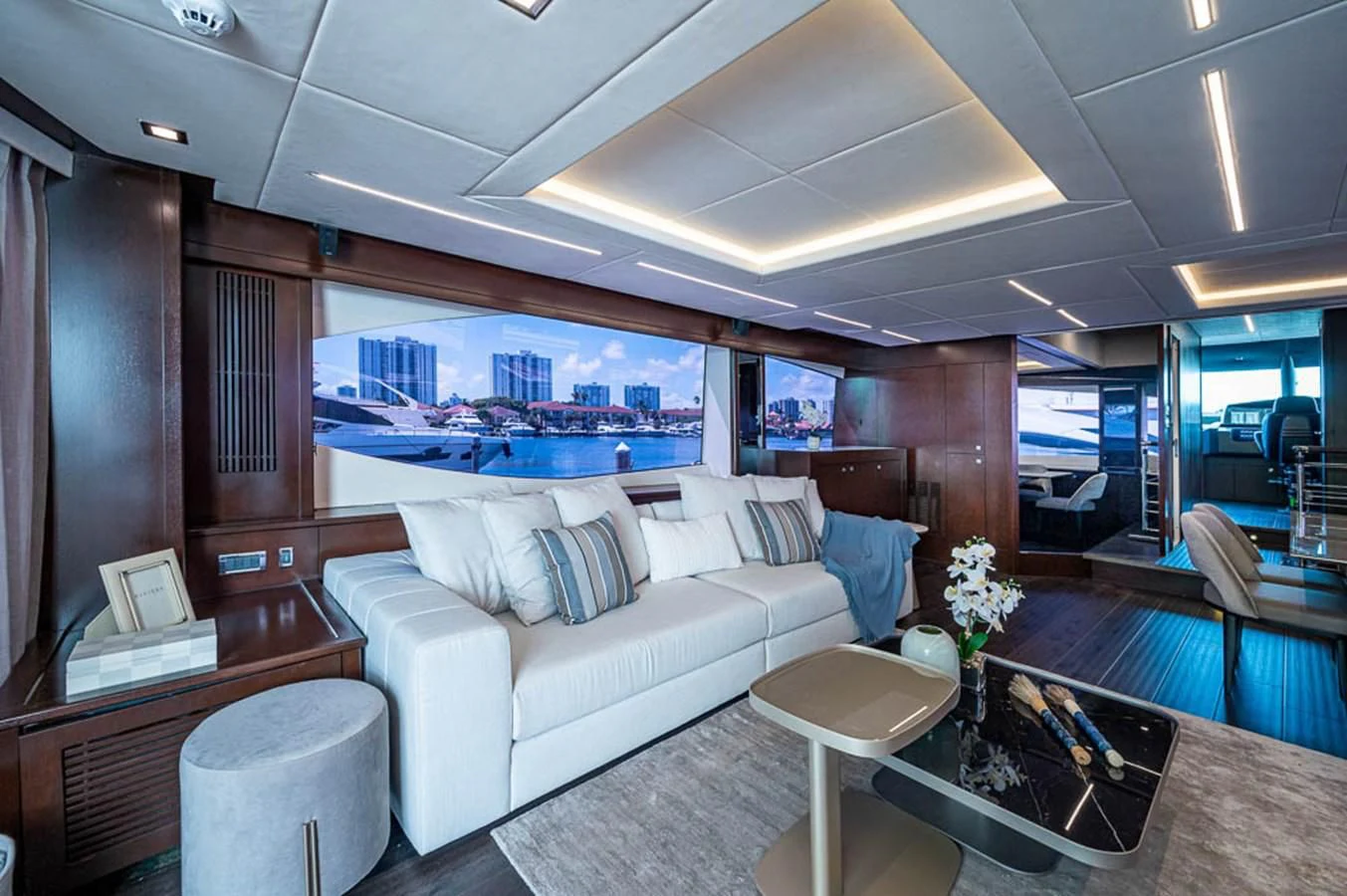 a living room with a large window aboard MOZZ II Yacht for Sale