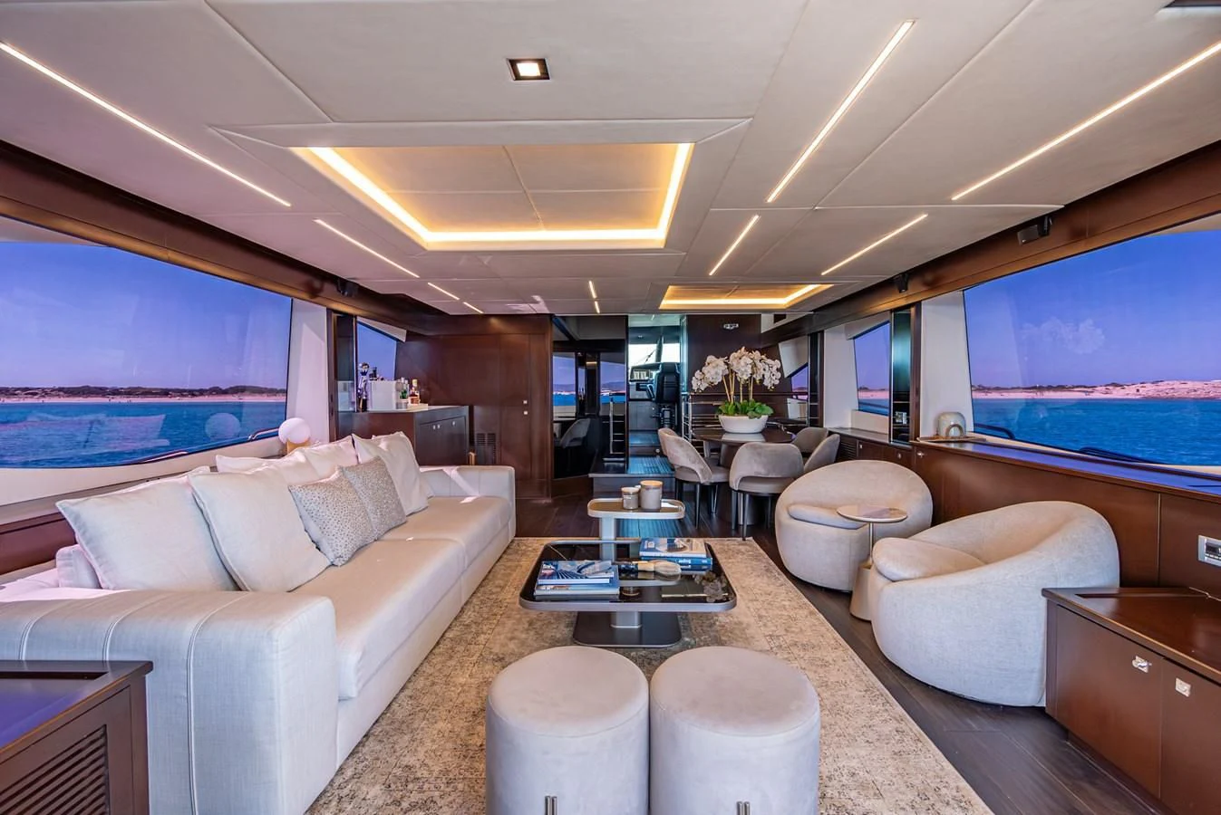 a living room with a large screen aboard MOZZ II Yacht for Sale
