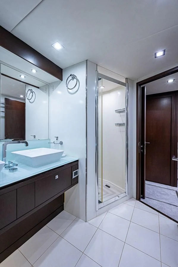 a bathroom with a sink and a mirror aboard MOZZ II Yacht for Sale