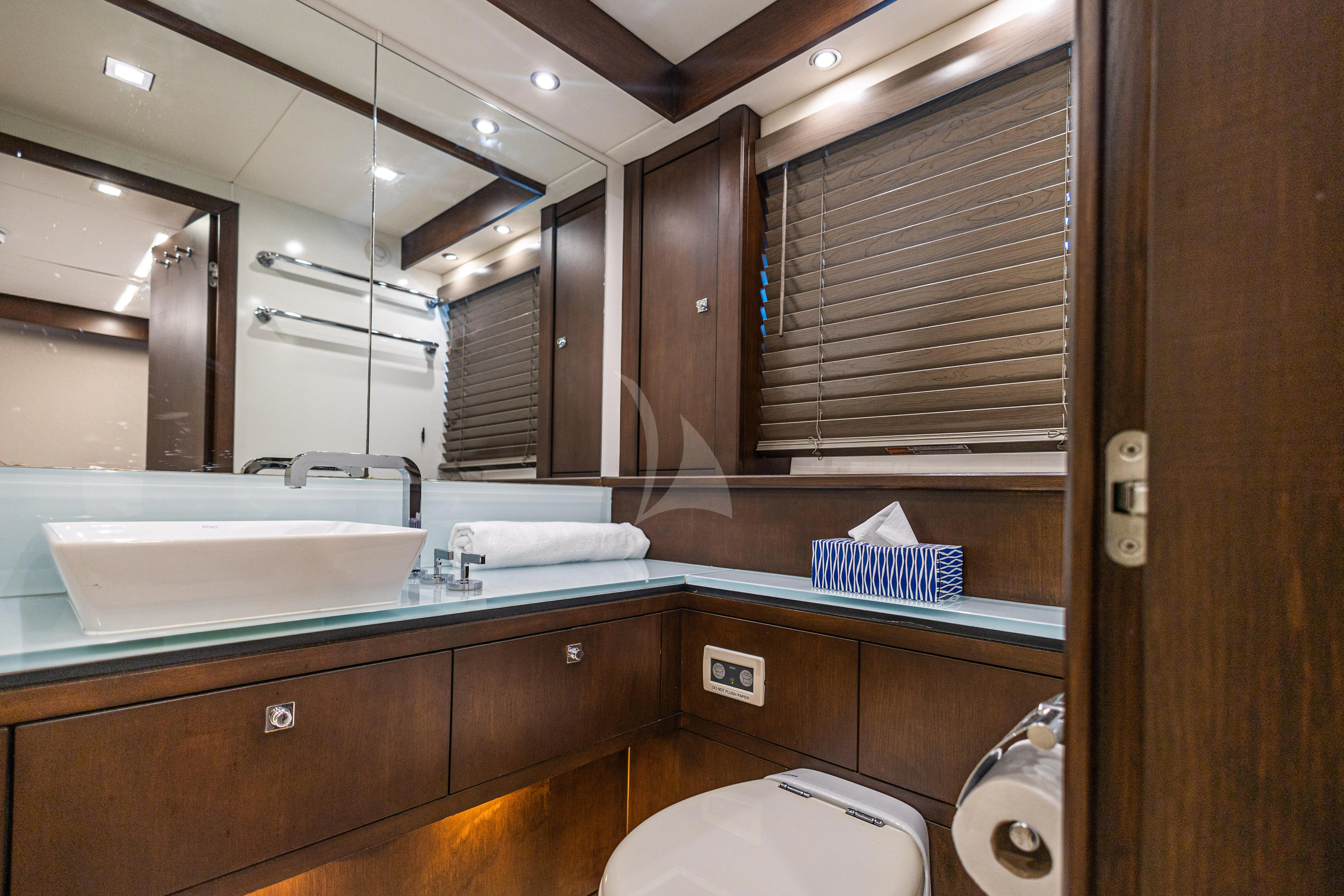 a bathroom with a sink and a toilet aboard MOZZ II Yacht for Sale