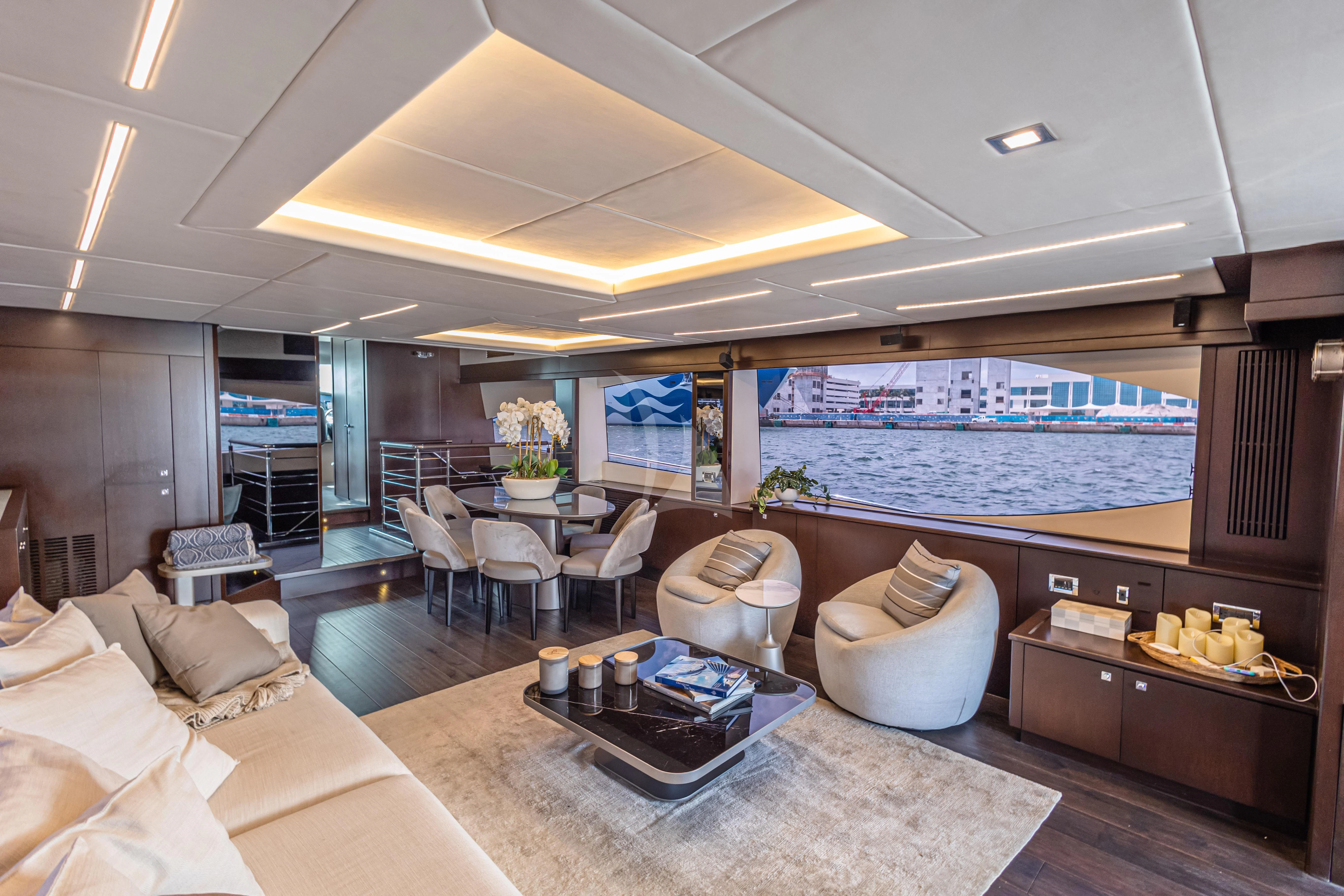a large living room with a large window aboard MOZZ II Yacht for Sale