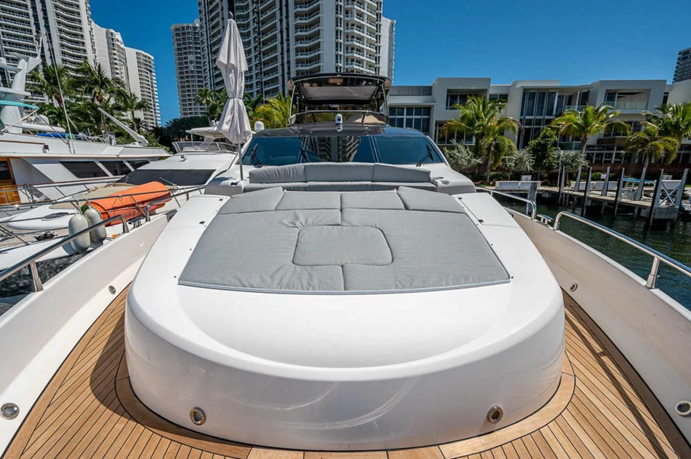 a large white pool with a water fountain in the middle of a city aboard MOZZ II Yacht for Sale