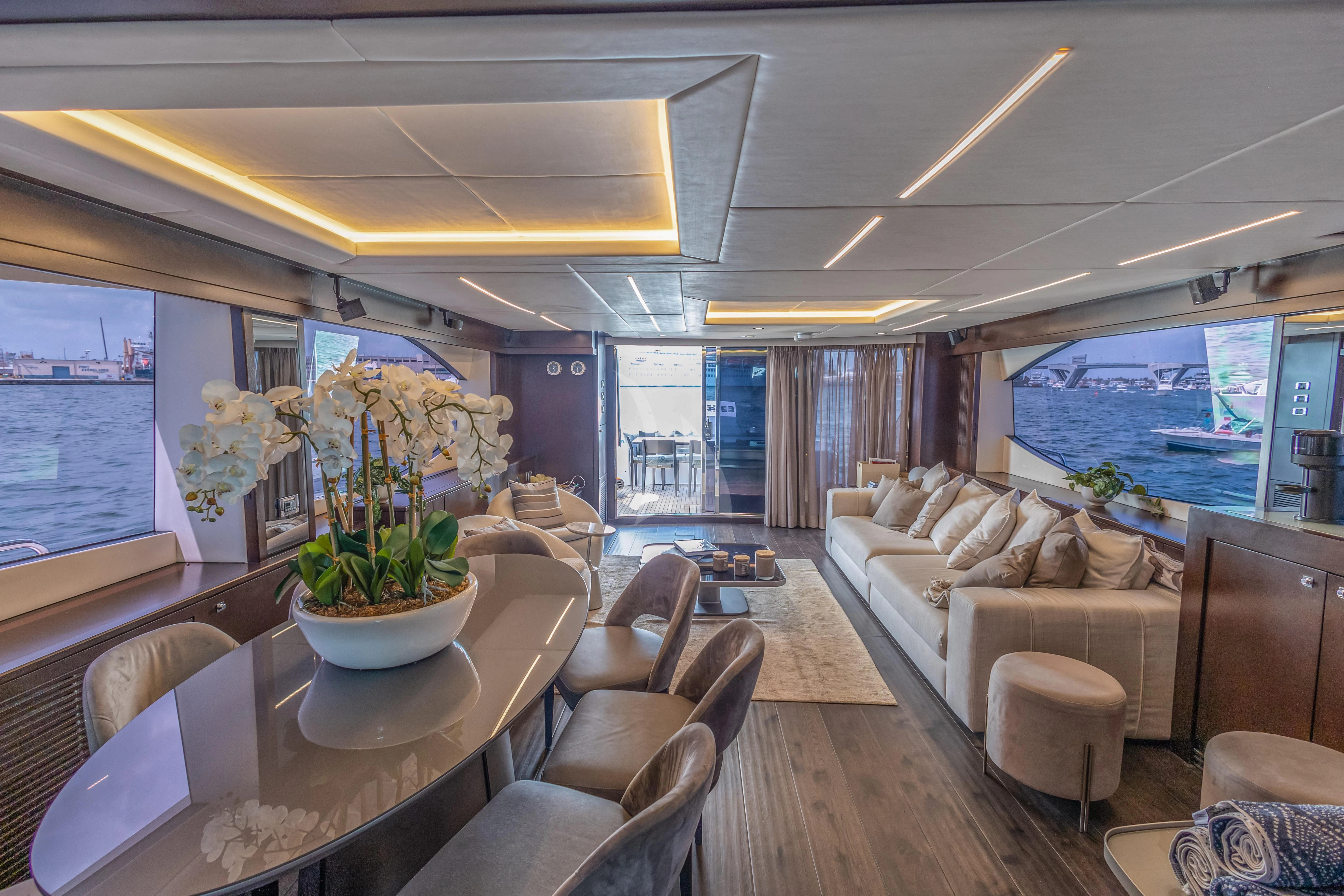 a living room with a large window aboard MOZZ II Yacht for Sale