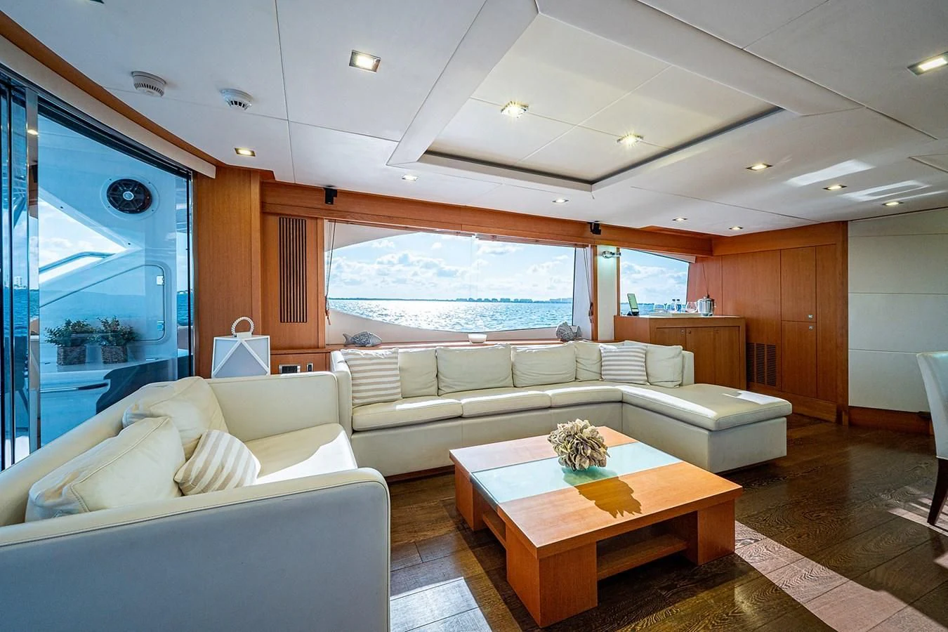 a living room with a large window aboard MOZZ II Yacht for Sale