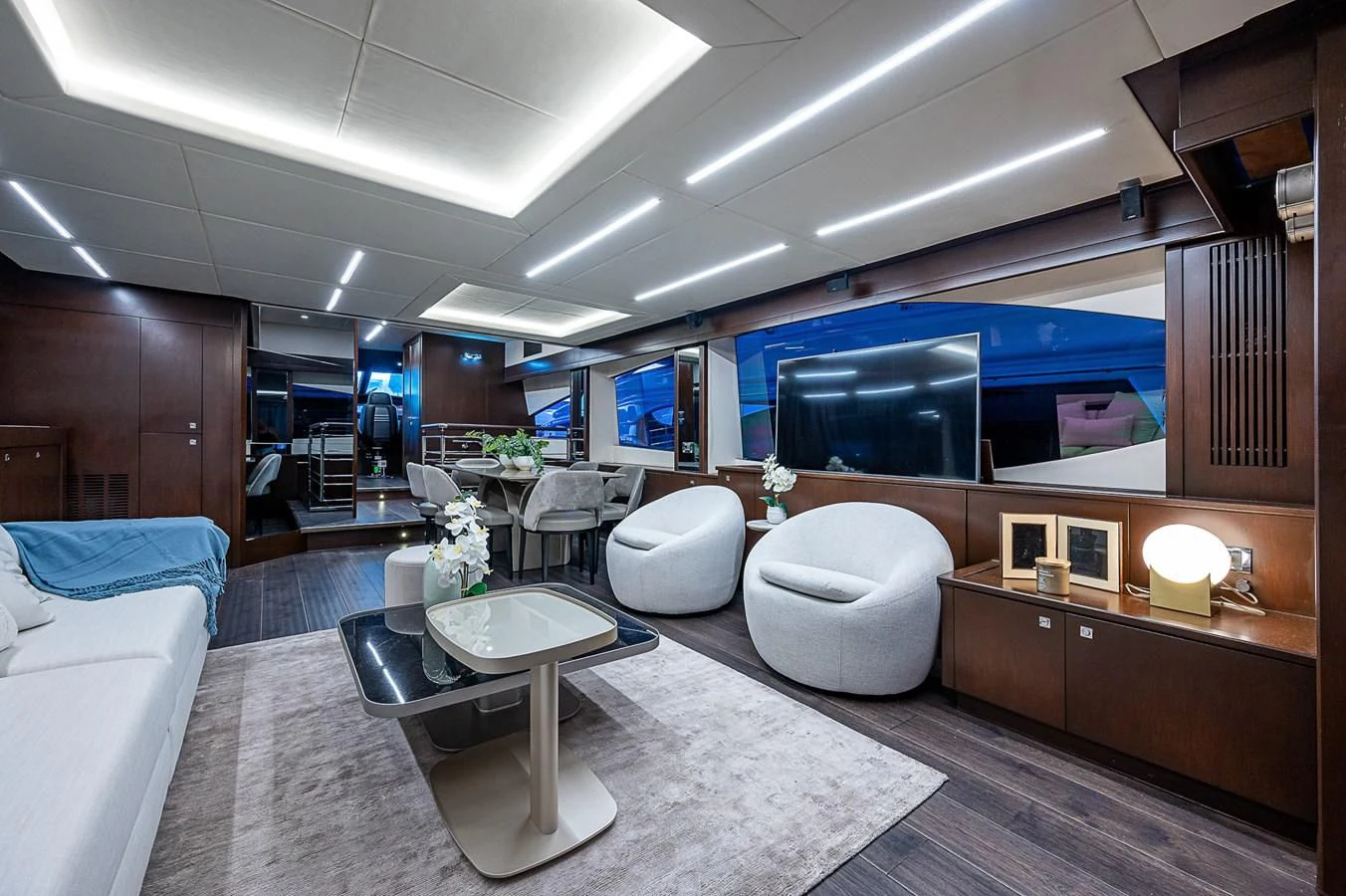 a modern looking room with a large tv aboard MOZZ II Yacht for Sale